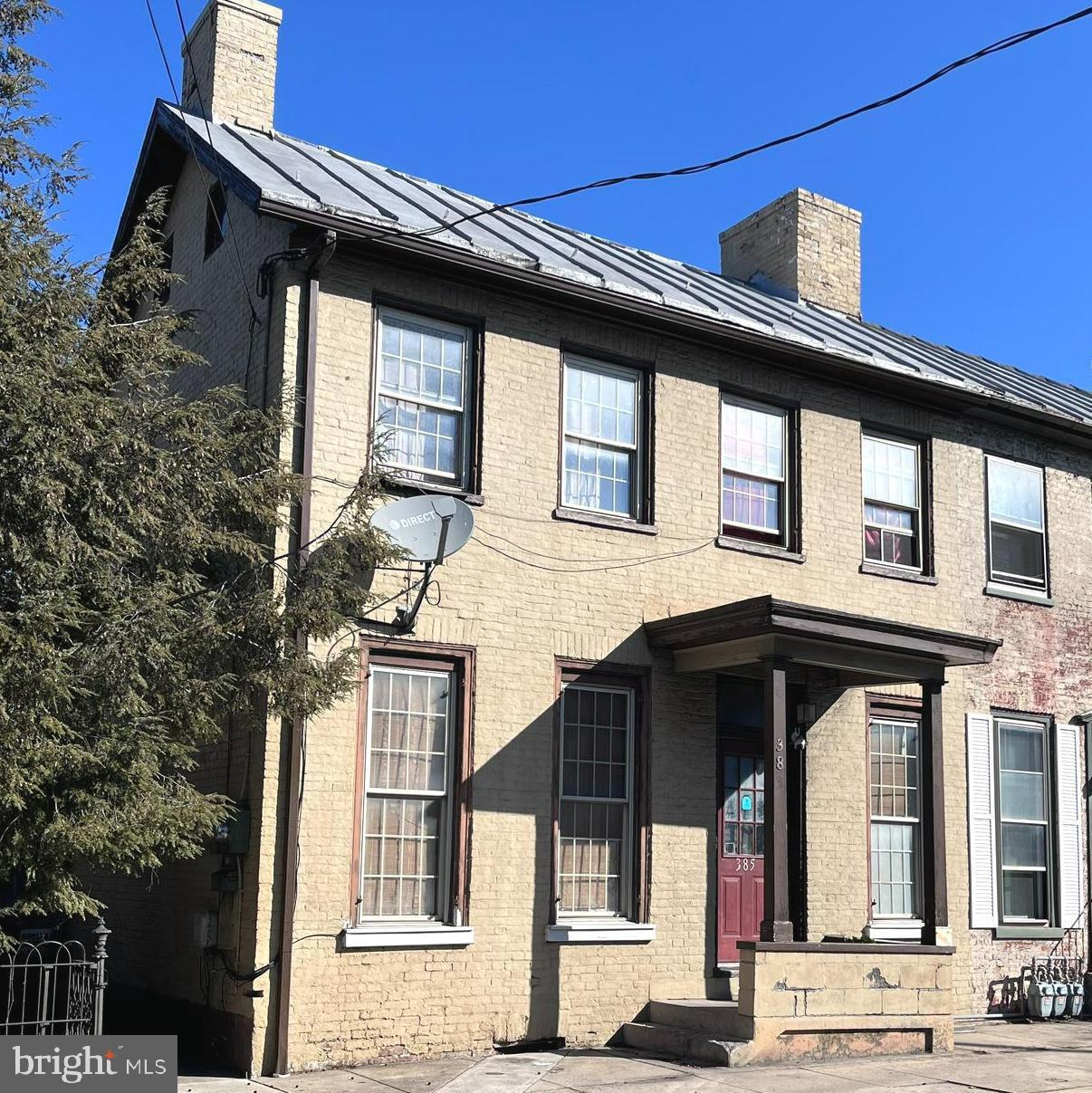 This all-brick, 1/2 duplex offers convenience and 1900's charm. The outside offers a side porch, balcony and rear patio. Inside you will find a main floor master off the kitchen, main floor laundry, cozy living room and large eat-in kitchen. Three bedrooms and a full bathroom complete the upstairs. Enjoy downtown living with added convenience and style. This property is being sold AS-IS.