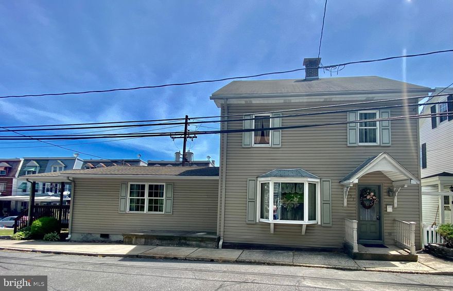 Move In Ready! This 3BR/1BA single is located close to schools and walking distance of the downtown. The home features a welcoming foyer, eat-in kitchen, formal dining room with large bay window, living room and an amazingly spacious great room which will quickly become the gathering place for family and friends. Up the staircase are three nicely sized bedrooms, full bath and easy access to the walk-up attic.  Other amenities include covered deck for the ultimate in outdoor enjoyment rain or shine, full basement with loads of storage, and two built-in garage spaces.