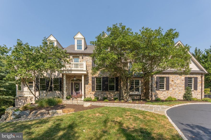 Class and elegance abound in this exceptional 8,500 sq ft stone-front estate home situated on 1.73 acres in the prestigious Fawn Creek community of Worcester Township and in the highly sought-after Methacton School District. Hollow Road is one of the most beautiful roads in Worcester and perfectly situated along the Zacharias Creek Trail which connects to the nearby Heebner Park Trail.  The 1.4 mile Zacharias Creek Trail also extends to the edge of Evansburg State Park (the township is currently in the planning process to connect the trail with those in the State Park).  Custom-built in 2001 by Philip Mascio, of the renowned Erb-Mascio Builders, for his personal residence, quality construction and attention to detail show throughout the home, notably in the extensive finish carpentry, arched doorways, custom millwork, shadow boxes and stunning windows/natural light throughout.  With the home nestled out of sight from the road, the driveway leads to a circular drive at the home’s front.  A sweeping 2-story foyer with a dramatic curved stairway welcomes you upon entry.  A formal living room and dining room surround the foyer both with custom wall murals of historic local scenes.  The gourmet eat-in kitchen offers abundant cabinetry with integral lighting and glass fronts, a center island with seating, tile backsplash, contrasting quartz and soapstone countertops, tile floor, rear staircase and breakfast area. The breakfast area opens to an expansive Bluestone patio with an outdoor kitchen and overlooks a level, open yard flanked by trees/woods for absolute privacy.  The kitchen also opens to the family room with a stunning coffered ceiling and gas fireplace.  A private home office boasts two built-in desks and a balcony overlooking the woods.  A sunroom offers a wonderful place to unwind and relax.  Two powder rooms and a separate laundry room complete the main level.  At the top of the stairs, a cozy reading area awaits.  The main bedroom offers a vaulted ceiling, gas fireplace, private balcony overlooking the yard, and a luxurious en suite bath with corner tub and walk-in tiled shower with multiple shower heads.  A full closet with custom organizers and a separate sitting area complete the owner’s suite.  Four other bedrooms along with two full baths (one a Jack-n-Jill) complete the 2nd level.  There are walk-up stairs to a finished 3rd floor that can be used as an additional bedroom or play area.  The 3rd floor also offers ample unfinished attic storage.  The walkout basement is fully finished with a large recreation area, full bath, movie theater room with custom seating for 8, a workout room with stairs direct to the garage and an unfinished area for storage.  A paver patio sits outside the basement's French doors to the side yard, a paver walkway steps up to the rear yard. Oversized 3-car garage with a Gladiator Wall Organizer system.  A picturesque outbuilding with pull-down attic storage offers additional space and potential uses.  Public water, public sewer and natural gas heat for peace of mind.  Current sellers performed an invasive stucco test with very favorable results when they purchased the home in 2014.  Easy walking access to the 84-acre Heebner Park with 2.25 miles of walking trails, a playground, soccer and baseball fields, tennis and basketball courts, and picnic areas.  This home is also within a 5-minute drive of Cedars Village, Worcester Golf Club, Skippack Golf Club, and the charming, ever-popular Skippack Village with many boutique shops, restaurants, parades and seasonal events.  With several preserved open spaces and conservation lands nearby, 1760 Hollow Rd is a tranquil oasis for discriminating buyers who appreciate peace, privacy and nature.