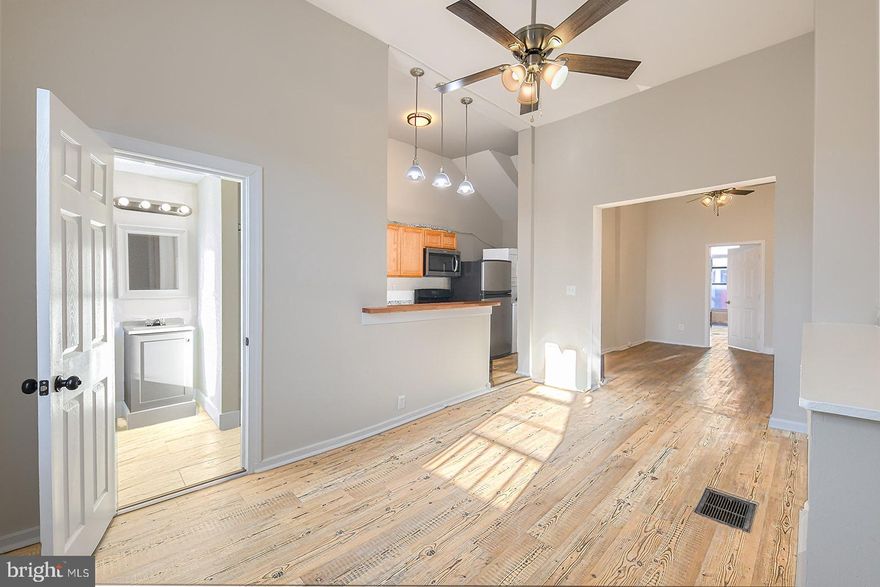 Welcome to this newly renovated first-floor apartment in Baltimore's historic Union Square neighborhood. This 1-bedroom, 1-bathroom unit offers a thoughtful layout with an open flow between the kitchen, dining, and living spaces.

Step inside to find a functional kitchen equipped with brand-new cabinetry, a stove with an above-range microwave, a refrigerator, and an in-unit washer and dryer for added convenience. The knee wall bar subtly separates the kitchen from the dining area, which benefits from large windows that bring in plenty of natural light.

The common living space is spacious and inviting, complete with a ceiling fan for comfort. The unit features three ceiling fans in total, ensuring good airflow throughout.

Toward the rear of the unit, the bathroom includes a walk-in shower with its own dedicated lighting, a modern vanity, and a sleek mirror.

Union Square is a neighborhood rich in history and character, with ongoing revitalization projects adding to its appeal. The community is known for its beautiful park, local events, and easy access to public transportation. Bus routes and the MARC train are nearby, making commuting or exploring Baltimore simple.

Water is included in the rent. Don't miss out on this opportunity schedule a tour today!