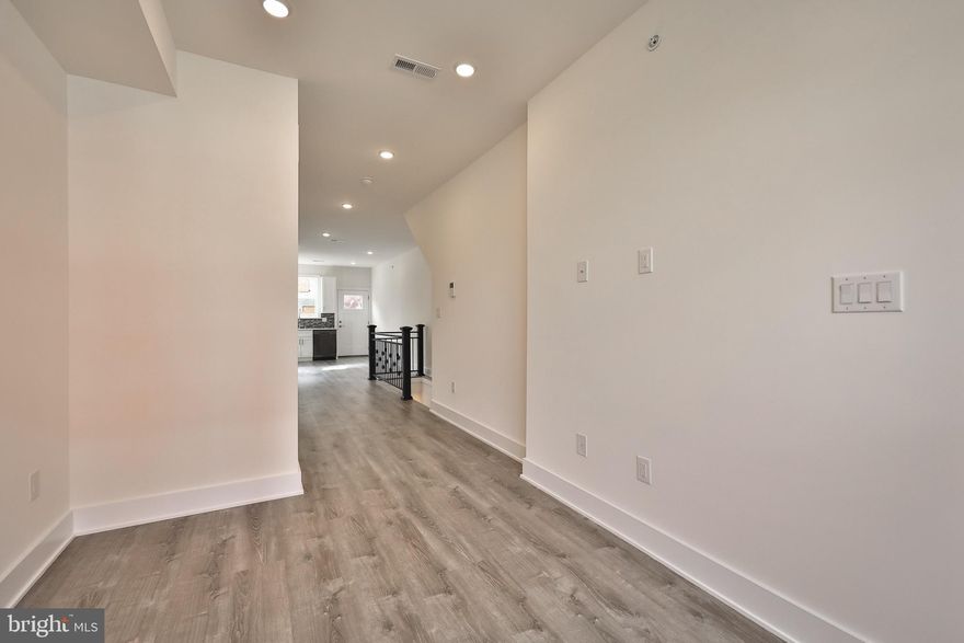 Investment Opportunity!! Beautiful New Construction duplex located right off of Temple's campus! One Year Builder's Warranty and fully approved 10 year tax abatement! Located on a great block adjacent to more new construction buildings sprouting up all over. Unit 1 is a 2 bedroom and 2 and a half bath first floor and lower level unit with a private back patio! Enter into a sprawling first floor that opens up to a gorgeous state of the art kitchen with plenty of natural light pouring in. On the lower level you will find two large bedrooms with an abundance of light and two full baths with contemporary finishes. Unit 2 occupies the upper levels of the building and displays an extremely spacious kitchen and living area drenched in sunlight through the westward facing oversized windows. The top floor showcases an amazing master bedroom with walk in closet and expansive, stylish bathroom with a shower stall and glass door. Do not miss the wet bar located right by your stairway to the private roof deck! Bedrooms renting in the immediate area for $700-900 each. You will have no trouble renting out this amazing new construction! Schedule a private tour today!