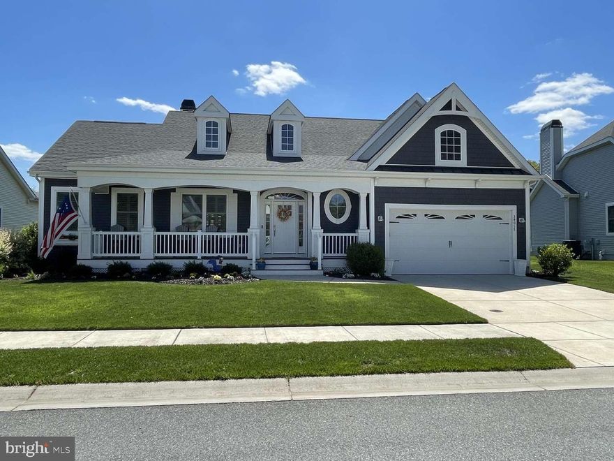 Beautifully maintained home in the highly desirable Coastal Club community in Lewes, Delaware. This Schell Brothers Mayberry model offers 4 bedrooms, 3 full baths, and a bright, open floor plan with engineered hardwood flooring, vaulted ceilings, and abundant natural light. The great room features a gas fireplace and a wall of windows overlooking the landscaped backyard. The gourmet kitchen includes quartz countertops, gas cooktop, double ovens, stainless steel appliances, glass‑front cabinetry, soft‑close drawers, an oversized island, and a walk‑in pantry. A custom bar with lighted glass cabinetry, granite countertop and minifridge enhances entertaining, and the extended dining/morning room adds valuable living space for large families and groups. The main‑level primary suite includes double vanities and an oversized floor-to-ceiling tiled shower. Two additional bedrooms, a flex room, and full bath nearby complete the first floor. A private second‑floor guest suite offers a walk‑in closet and fully tiled bath. Outdoor living includes a rear sundeck with built‑in gas line and a spacious 11,000 sq. ft. homesite, with an ag-well for irrigation. Additional features include a laundry room with utility sink and a walk‑in attic for storage. Coastal Club amenities include indoor/outdoor pools, infinity pool with swim‑up bar, fitness center, tennis and pickleball courts, walking trails, a dog park, and on‑site dining. Minutes to Lewes Beach, Cape Henlopen State Park, shopping, restaurants, and the Cape May–Lewes Ferry.