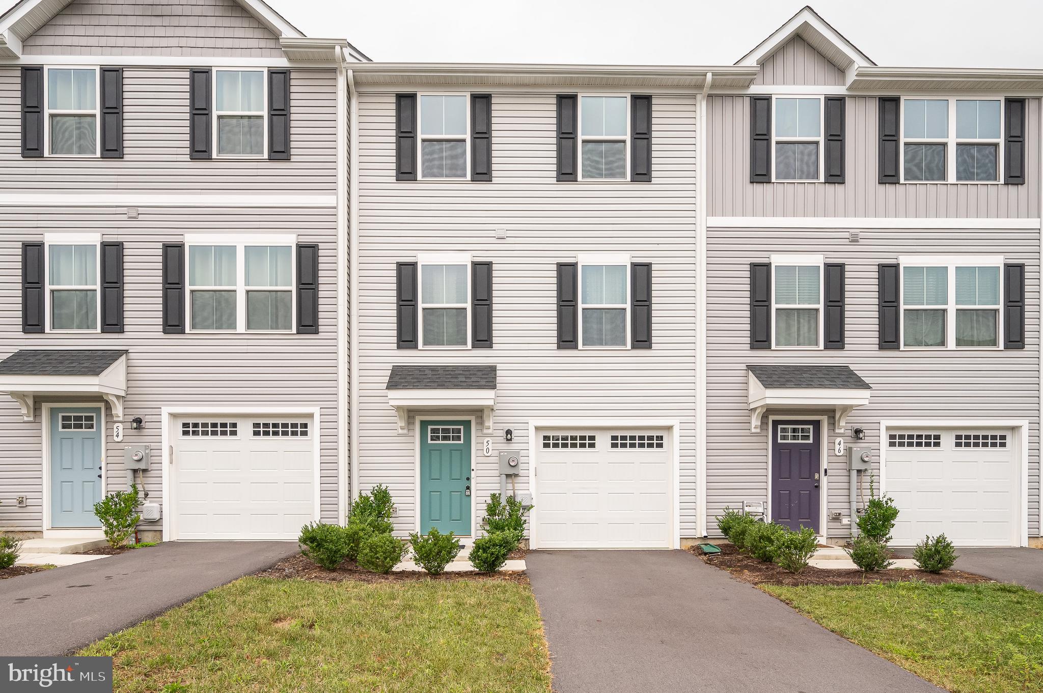 3 bed/2.5 bath Townhome Built in 2023, Juniper model w/ Fully Finished Lower Level. Walk in to lower level from 1-car garage. Lower level features a spacious foyer with hall closet and a flex space for a rec room, home office or gym. Lower level has direct access to spacious backyard. Walk up to main level area featuring a open kitchen, dining and living room. Direct access to *future* deck off of dining area. Powder room available for guest convenience off of living room. Upper level has 3 bedrooms, 2 full baths and laundry room. Primary bedroom with en suite bath and walk-in closet. 2 secondary bedrooms share the full hall bath. Laundry room on the upper level is a bonus. Community features sidewalk-lined streets, large park with covered picnic pavilion, a playground and oversized dog park. Make Martinsburg Lake your home today!