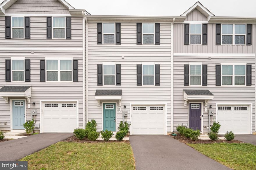 3 bed/2.5 bath Townhome Built in 2023, Juniper model w/ Fully Finished Lower Level. Walk in to lower level  from 1-car garage. Lower level features a spacious foyer with hall closet and a flex space for a rec room, home office or gym. Lower level has direct access to spacious backyard. Walk up to main level area featuring a open kitchen, dining and living room. Direct access to *future* deck off of dining area. Powder room available for guest convenience off of living room. Upper level has 3 bedrooms, 2 full baths and laundry room. Primary bedroom with en suite bath and walk-in closet. 2 secondary bedrooms share the full hall bath.  Laundry room on the upper level is a bonus. Community features sidewalk-lined streets,  large park with covered picnic pavilion, a playground and oversized dog park. Make Martinsburg Lake your home today!