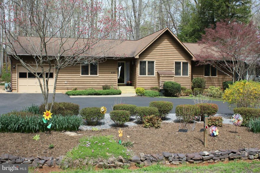 Get away from the busy lifestyle of the city, while still enjoying community living.  This beautiful, open concept home, surrounded by trees is only three blocks away from the lake and one of it's tranquil beaches. Relax in your screened in porch that overlooks a private backyard which leads to one of many walking trails and community parks. Enjoy golfing,boating, horse back riding, and much more.