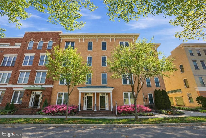 ** More photos coming. ** Experience the epitome of luxury living in this exceptional upper-level condo in Potomac Yard, boasting a host of exquisite updates. Nestled on the coveted top 2 floors, it features office space with custom built in bookcases. A notable floor plan spanning an impressive 2,800+ square feet. The interior is adorned with impeccable finishes, including walnut hardwood flooring, custom crown molding (2026), wainscoting, and brick half wall. The kitchen is a culinary enthusiast's dream, with white granite countertops, a matching backsplash, and stainless-steel appliances. A cozy sitting room adjacent to the kitchen boasts a double-sided gas fireplace, providing a warm ambiance for relaxation. (annually serviced and new starter 2026) Step out onto the balcony, an ideal space for coffee in the morning. The generous great room offers a spacious layout perfect for both luxurious and casual living and dining. Upstairs, the master suite invites you to unwind with a spacious walk-in closet and an en-suite bathroom featuring an expansive shower and a dual sink vanity. Two additional well-proportioned bedrooms, a full bathroom, and a conveniently located laundry room complete the upper level. Each bathroom has upgraded lighting and 110 & 200+ CFM bathroom exhaust fans. With a 1-car garage in addition to a driveway, you'll find ample parking and storage space. Entrance level features a tailor-made coat closet and storage with custom woodwork. The garage even includes foldable gym equipment and Schwinn AD7 Airdyne Bike, transforming it into a versatile gym space with premium floor mats or serving its primary purpose as parking. Take advantage of Potomac Yard and Del Ray's offerings, including shopping, restaurants, a weekly farmers market, and more! This prime location offers easy access to Potomac Yard, Old Town, and the Virginia Tech Innovation Campus. The Potomac Yard metro station is just seven blocks, ensuring effortless commuting and easy access to all that Washington, D.C. has to offer. Don't miss this opportunity to make this stunning condo your new home.