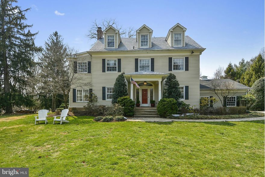 Beautiful 100 yr Colonial with updates galore and tons of natural light.  Grand foyer flanked by a large inviting LR w/FP & elegant Dining rm. Prof remodeled kit opens to breakfast area and family rm w/vaulted ceilings & fireplace. Sunroom. Luxurious master suite w/2 dressing rms & huge master bath w/jetted tub & steam shower. Separate gym. Nestled on 2.6 acres of privacy w/golf course views.