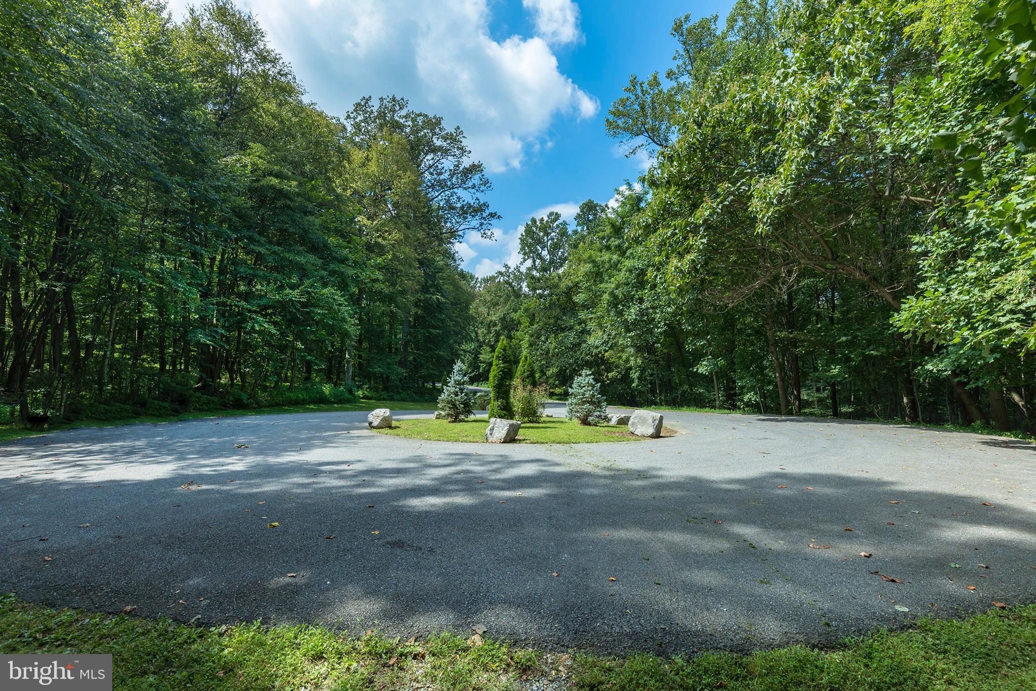 Build your dream home on this undeveloped 121+ acre wooded sanctuary on a private road cul-de-sac in The Reserve, a popular community in southern Lancaster County. Enjoy the opportunity to pass down to generations. Few properties in the region that are of this size, are wooded, and don't contain an existing home, and where surrounding properties cannot be developed. If you're looking for serenity, this is ideal. The Reserve comprises just 6 homes. Bordered by Steinman Run nature Preserve, a 309 acre wooded property (owned by the Lancaster County Conservancy, so it won't be developed), and Drumore Estate, a 70 acre property with a mansion which was the former summer home of Lancaster magnate John F. Steinman.
Just 15 minutes from downtown Lancaster, your idyllic home will be safely nestled in the tranquil, undisturbed beauty of this distinctive property, away from neighbors and busy roads. Enjoy the blissful peace of being in your own relaxing refuge, hidden away from the outside world. This property is like having your own personal park. Explore it using the established trail system, some of which were old logging roads. This haven has a different look and feel in each of the four seasons. You won't tire of the never-ending beauty of this retreat. Enjoy abundant wildlife such as deer, squirrels, hawks, owls, and much more. There is no better therapy than to sit along the Steinman Run, which flows through the property. There is even a small waterfall. This soothing waterway is home to minnows, frogs, and the occasional turtle. You could easily spend hours listening to water make its way downstream. Relax on one of the many rock outcroppings perched atop the hills to view your personal paradise and to enjoy a higher view.
A bit of history . . . The property once contained several charcoal pits, which were used to make charcoal for nearby Martic Forge in the mid 1800's. Evidence of those pits still exist on the tract. The property was once part of the Drumore Estates, before that vast tract was subdivided to create The Reserve. Drumore Estates was founded in 1938 when Lancaster newspaper magnate & philanthropist John F. Steinman sought out a hilltop in the Lancaster County countryside to build a peaceful retreat. This estate is situated on the second highest peak in Lancaster County. Philadelphia architect Robert R. McGoodwin was commissioned to design the 16,000 square foot brick Georgian mansion so that it best complimented the natural beauty of the property. The mansion property adjoins this property.
To ensure the natural aesthetic of The Reserve and to maintain its private drive (Vestral Drive), an HOA has been established, averaging approximately$200.00 per year. Up to two horses are also allowed. To protect Steinman Run and the waterways to which it flows, a conservation easement along the stream has been established in cooperation with the Lancaster County Conservancy to ensure Steinman Run will be maintained in its current pristine condition. This ensures your enjoyment of this unique asset of this property.
The current owners have been conscientious stewards of the property. They have maintained the established trails and created new ones to further enjoy the beauty of this serene oasis . They have worked to keep the property in its natural, unspoiled state while looking ahead to ensure this forest will thrive in the years to come. They worked with a state forestry agency & with the U.S. Forest Service to have a Forest Stewardship Plan (FSP) created for the property. A FSP provides the landowners with the information and tools they need to manage their forests and woodlands by protecting air quality, wildlife habitat, natural beauty, and establishing watershed protection. It has achieved a "Stewardship Forest" designation.
Enjoying the pride of your custom dream home, along with the peaceful and natural splendor of this property, is truly a unique, generational opportunity.