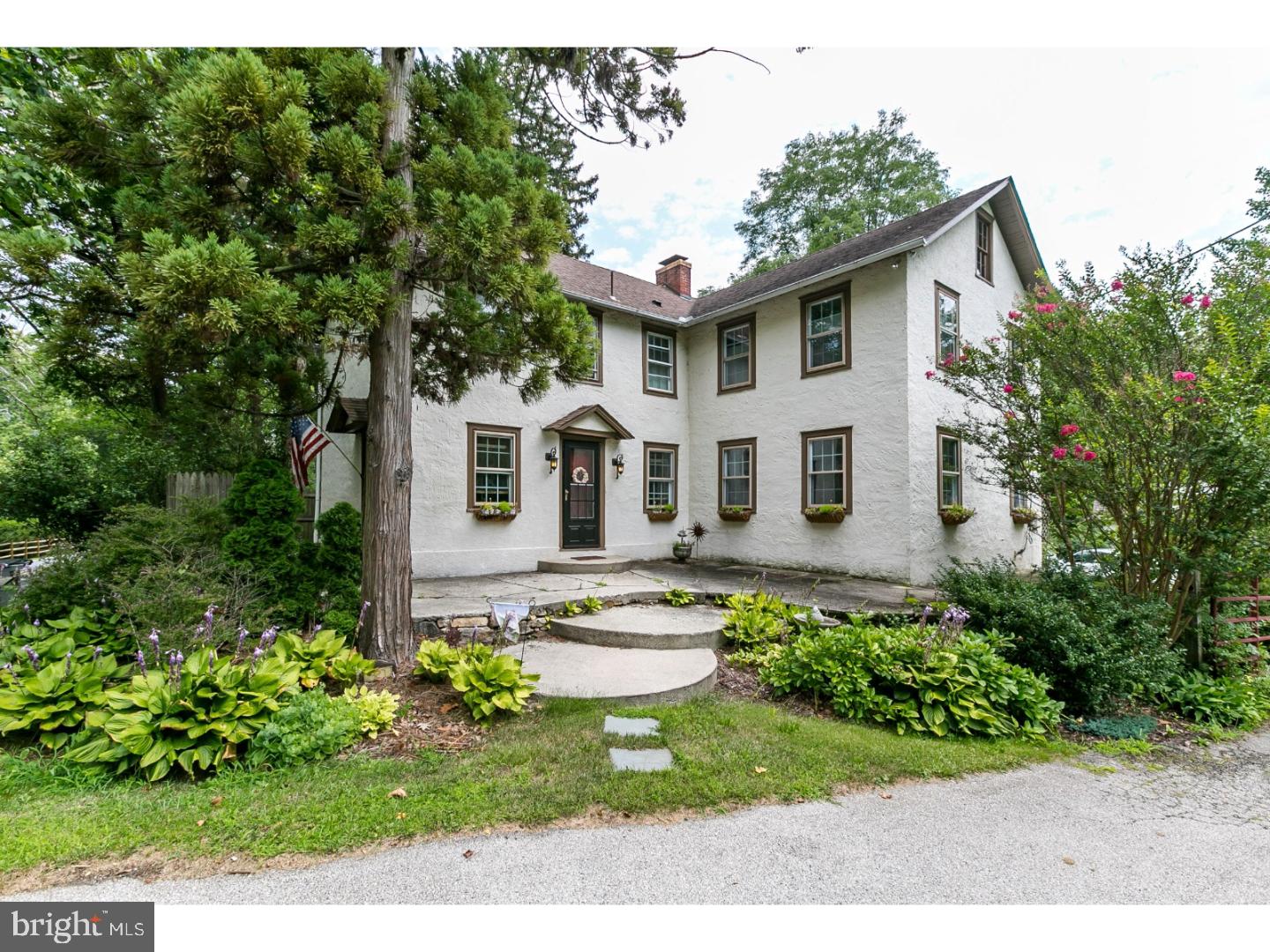 If you have been looking for a gorgeous, renovated farm house that sits on beautiful grounds in the award-winning Great Valley School District, then look no further!!!!  The owner has loving maintained the home and has expanded it with a two-story addition to offer additional living space, yet has kept many of the home's original features to preserve its character and charm!  Enter into the foyer and extra-large mudroom that has its own cabinets, countertop, double porcelain sink, built-in shelving, and cubbies, offering plenty of storage for your coats, bags, shoes, etc.  The kitchen has been tastefully updated with a new floor, pantry, Thermadore stove with gas cooktop, and gorgeous views of the private back yard.  Get ready to host many dinners in the bright and sunny dining room which can easily accomodate an oversized table to entertain plenty of guests and features gleaming hardwood flooring and a beautiful built-in corner china cabinet.  The living room is spacious but still provides a warm, inviting atmosphere with a gas fireplace, hardwood flooring, and a unique curved staircase to the second floor.  An office with custom built-in shelving, powder room, and second staircase to the upstairs complete the first level.    Upstairs you will find a large room that would be perfect for a family room or playroom and can be closed off with its pocket doors.  The master suite has double cedar closets and a master bathroom.  The two additional bedrooms have plenty of closet space and can easily access the second full upstairs bath.  A large laundry room with cabinetry and built-in shelving is also conveniently located on the second floor.  There is an abundance of storage throughout the home and in the walk-up attic and full walk-out basement which also has a workshop and half bath.  Outside is a private oasis of 2.2 partially wooded acres which provide a wildlife haven and is surrounded by perennial gardens and shrubs.  There is also a picturesque wooden bridge and stream which can be crossed over to a flat pasture area on the property.  All can be enjoyed on the large, wrap-around deck.  A 2.5 car detached garage is attached to a 16x14 adjoining room with fireplace and skylight that was once the local tannery (jointly have their own electric meter separate from the house).  A pre-inspection report is available upon request.  Located within close proximity to the Great Valley Corporate Center, Rt. 30, and Rt. 202!  Come see your new home today!