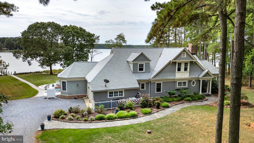 You'll feel like you're on a continuous vacation in this spectacular 4-bedroom, 4.5 bath coastal style home that features breathtaking, panoramic views of Broad Creek and only 2.5 miles from charming historic St. Michaels. A setting that is truly "vacation like" with a stunning waterside pool/spa complex, outdoor fireplace, outdoor room with automatic screens, a large hardscaped patio, 300 feet of living shoreline, a dock with 5' MLW and boat lift. The open floor plan offers exceptional water views from all rooms and exquisite finishes including hardwood floors throughout, luxurious spa like bathrooms and custom built-in features. The main living area features a double-sided fireplace and a game room that could also serve as a dining area. The beautiful kitchen offers a built-in banquette breakfast area, dining counter and stainless appliances and is adjacent to the owner’s yoga room that includes built-in wine storage which could also serve as a studio or office. The main level primary bedroom captures the beautiful views of Broad Creek and has a primary bath that is unparalleled. Upstairs, you'll appreciate the design quality of the three ensuite guest bedrooms with beautiful spa bathrooms and exercise room. This fully renovated and updated home has all the features that one would want to serve as their primary or vacation home and also features a 2-car garage and storage shed. You won’t want to leave the stunning, private setting but only for the charm of quaint St. Michaels. ** Please click on the movie camera icon to enjoy the virtual tour,