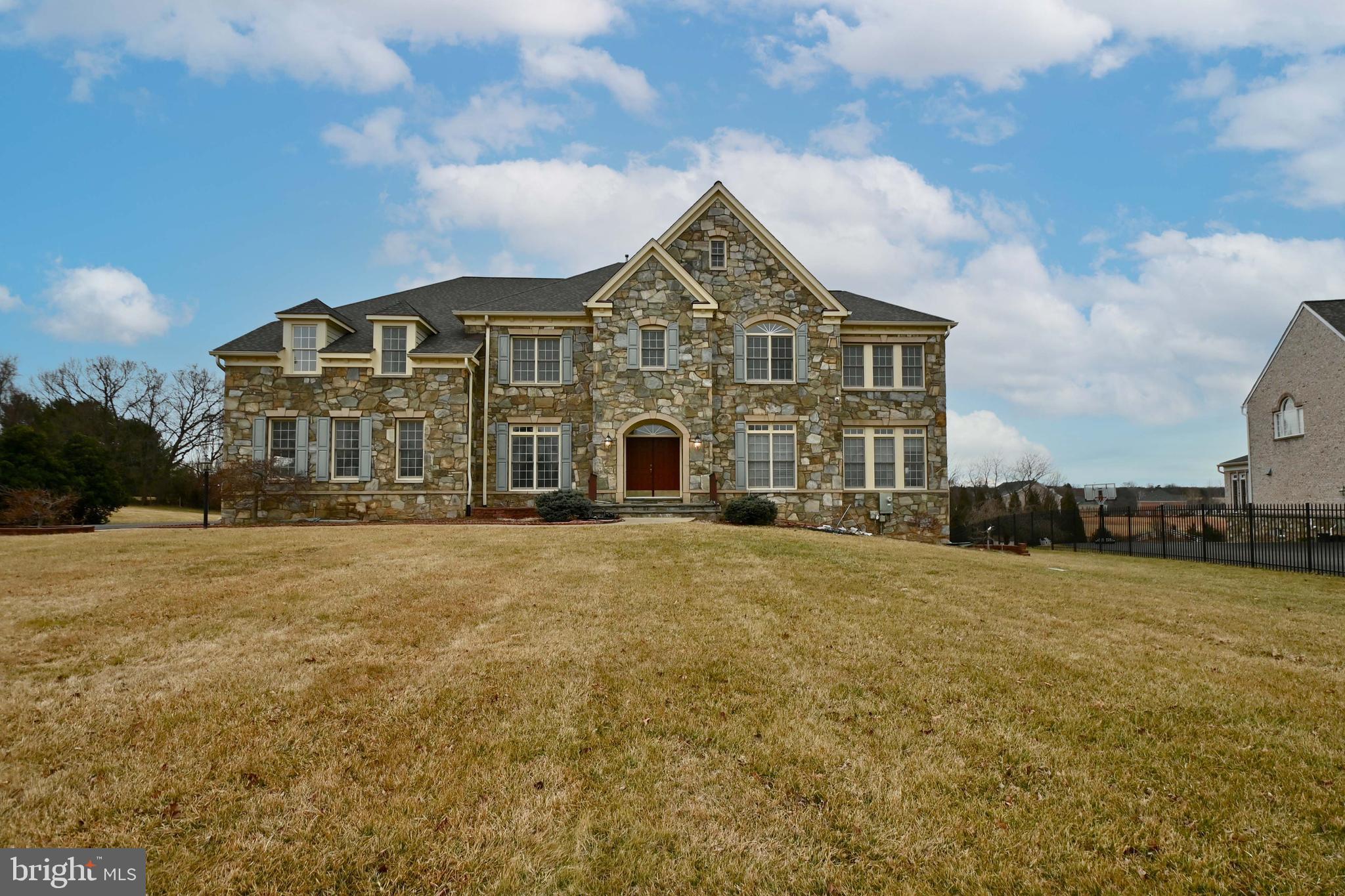 Gorgeous stone front home on 2 acre homesite in Potomac boasts 6 bedrooms, 6 full baths, and 3 half baths, over 7,700+ sq. ft., finished rec room with full wet bar, full and half bath on lower level. Spacious gourmet kitchen. Great room and family room. Large bedrooms and all are en-suite with their own full bathrooms. Enormous primary suite with large full bathroom. Backup Generator. Excellent location close to I-495.
