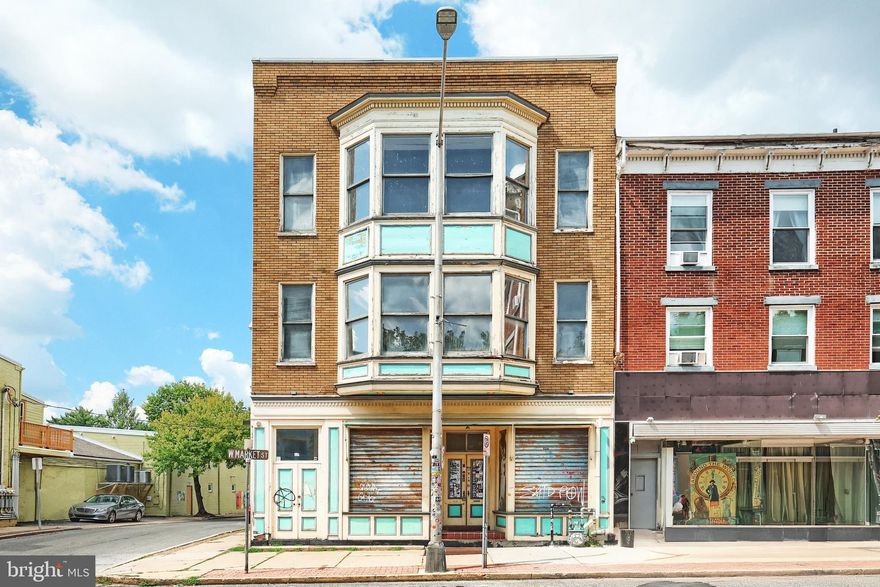 Do you want to Rock and Roll all night?  Dance until you see the sunlight?  Maybe you make a world class lasagna and the world needs to know about it.  Formerly Skid Row Garage, and before that Sam and Tony's Pasta house is up for sale.  This popular downtown club with recently constructed stage has finally hit the market.  
Not your style for your dream project?  It's just paint!  Previous owner made the venue his own and you can too.  There is capacity for 160 people, and it's been reached many times.  Backstage and small green room area for musical acts, and large checkered dance floor/the pit is spacious enough to accommodate those who like to go right up front and the wallflowers who prefer to watch from the sides.   Full kitchen nestled in hallway to bathrooms leads to back deck bar, complete with large ice maker, bottle cooler and stools.  Stylized garage doors open to large back deck and patio which is perfect for the crowd on summer nights or when they need a break.  All outside seating and tables included.  Fenced in but big enough to bring in vendors from every walk of business for the show.  Oversized 2 garage in rear of property is great for storage as well.  
Upstairs is 1 BR, 2 BA unit which is ...in need of some love.  LVP flooring is available with property for this project though in the 9 ft family room.  Both bathrooms need some rehab work.  3rd floor 1 BR 1 Ba unit has awesome family room with cathedral ceiling, brick exposed wall and large bay window looking out over Market st.  

Extra flooring included for checkered audience area, and hallway tile.  The future of this eccentric and dare I say beloved place is up in the air.  It needs someone with the vision and desire to turn it from the little club that could, to reach it's full potential as what it really could be...  A downtown staple of York, PA