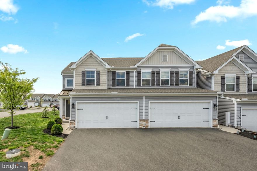 Welcome home to this like-new, end-of-unit townhome in the desirable Rolling Meadows community. Built in 2021, this modern 3-bedroom, 3.5-bath residence offers approximately 2,347 sq ft of finished living space on a low-maintenance lot. The end-unit location provides extra privacy, natural light on the side, and added yard space.
The exterior features beautiful curb appeal with fresh beige siding, stone accents, a welcoming covered entry, and a two-car attached garage with ample driveway parking. Manicured landscaping and a bright, open setting make this home stand out.
Step inside to an open-concept main floor perfect for modern living. The gourmet kitchen is a showstopper with a large center island (seating for four), white shaker-style cabinetry, sleek gray countertops, stainless steel appliances (including a French-door refrigerator), and elegant black pendant lights. It seamlessly connects to the living and dining areas—ideal for everyday living and entertaining.
Upstairs you’ll find three spacious bedrooms, including a private primary suite with its own full bath, plus a second full bathroom and a convenient powder room on the main level.
The full basement (approx. 550 sq ft) is a standout feature that also has its own full bathroom and is already equipped with a premium Lutron Lighting System that includes motorized blinds. This smart setup offers exceptional convenience, energy efficiency, and ambiance—perfect for a home gym, playroom, media room, home office, or future finished living space.