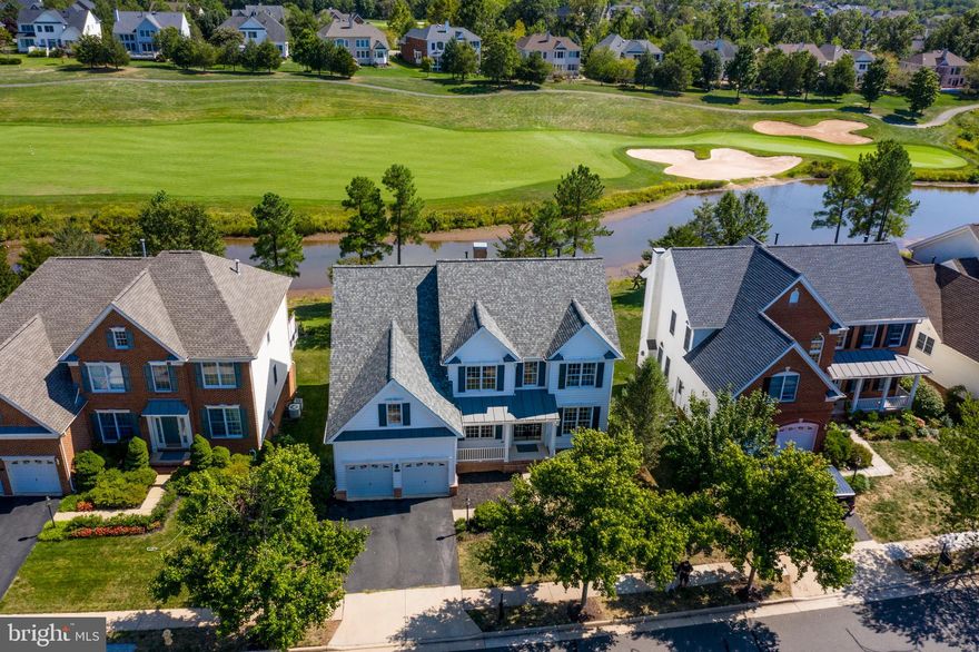 Open House Sunday Oct 6  1-3PM! Stunning Farmhouse-style Ellsworth in amenity-filled Dominion Valley Country Club. This turnkey home offers premium lot with breathtaking views of golf course and pond from all three levels, neutral designer paint and new stylish light fixtures throughout. It is located in the desirable main gate of the community within walking distance to the Club House, sports pavilion, pool, tennis courts and playgrounds. It offers 5 bedrooms, 3.5 baths, main level home office and over 4,700 fin sq ft. The open floor plan is ideal for entertaining and features wood floors, grand 2 story Family Room with gas fire place, gourmet Kitchen boasting chic white cabinetry, granite counter tops, center island and stainless-steel appliances including a double wall oven. Amazing sunroom addition and the large maintenance-free deck is where you ll enjoy your morning coffee admiring the peaceful views. The Formal Dining Room is perfect for dinner parties and features elegant tray ceiling. Spacious owner s suite offers a sitting room, large walk-in closet and a spa-like MBA with upgraded tiles and a corner jacuzzi tub. Brand new fully finished walk-out basement is filled with light from extra windows and boasts a huge rec room, 5th bedroom, home gym, full bath and tons of storage. Additional features include new roof (2017) and upper level HVAC (2017)as well as home warranty.