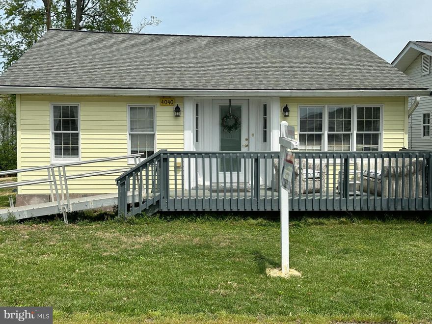 Charming North Beach rambler ideally situated just blocks from the Chesapeake Bay and within walking distance to local shops, restaurants, bars, art galleries, the new library, fishing pier, boardwalk, and beach. Enjoy coastal living with small-town charm and everyday convenience right outside your door. This two-bedroom, two full bath home features an open floor plan highlighted by a cathedral ceiling spanning the great room and kitchen, creating a bright and spacious living environment perfect for relaxing or entertaining. The main level includes a dedicated laundry area with full-size washer and dryer for added convenience. Outdoor living is equally inviting with a front deck overlooking the yard and a rear deck that opens to a large backyard — ideal for gatherings, gardening, or simply enjoying the outdoors. The extended driveway provides ample off-street parking and runs from the front of the home to the rear alley for easy access. Conveniently located for commuters with easy access to Washington DC, Annapolis, Joint Base Andrews and Baltimore, this property is perfect as a primary residence, weekend retreat, or investment opportunity. Experience the best of beach-town living in the heart of North Beach.