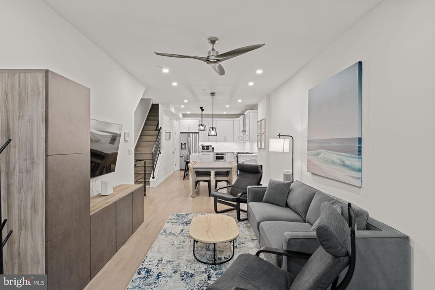 Convenience and comfort at Innovator Village!  Conveniently located for a quick commute to major business hubs and hospitals in either Center City or University City including HUP, CHOP, UPenn, Drexel, etc. and close to area amenities like Breezy’s Deli, Porco’s, Bagels & Co, Dock Street Brewery, Tuck Barre & Yoga, Aldi, CVS, and more!  Comfortable low maintenance living in a pet-friendly, gated community with upgraded finishes throughout and 6 years Tax Abatement remaining!  The main living level has hardwood floors throughout an open floor plan for living, dining, and kitchen space, as well as an entry area for shoes, coats, AND a coveted main floor half bath upgrade.  The kitchen features white shaker cabinets, Calacatta backsplash, large island with a Calacatta quartz waterfall edge counter and seating, and stainless steel appliances.  The primary bedroom suite has its own bathroom with tiled walk in shower and closet outfitted with built in organizers.  The remaining two bedrooms are on a separate level and each have their own closets with organizer systems, and one of the bedrooms has direct access to the hall bath, also with tiled walk in shower.  Also on this level are the laundry and utility closet and a separate linen closet.  All 3 bedrooms offer superior privacy as they do not share adjoining walls with one another - a nice feature especially for those with un-aligned sleep schedules.  There is also parking lot within the community that offers monthly paid parking (subject to availability).  If you are ready to move in with just your suitcase, all furnishings are available as a package for an additional fee.