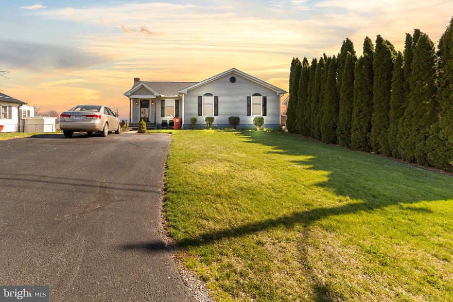 Welcome to 306 E 13th Ave! This immaculate, one-floor rancher boasts a spacious layout, featuring  3 large bedrooms, 2 full baths, beautiful hardwood floors, and abundant of natural lighting throughout. Situated in a very convenient location with no HOA, this property offers the perfect blend of comfort and convenience. Step inside this beauty to discover a cozy living space that's welcoming and inviting. Enjoy the expansive sunroom, perfect for relaxing or entertaining guests year-round.   The well-appointed kitchen features plenty of cabinets for storage, while the combined dining area is perfect for hosting family meals or dinner parties. With a separate laundry room, chores are a breeze, making daily living even more convenient all on 1 floor.  Venture to the basement to find a wood stove, adding to the charm and providing an additional source of heat. This room could be used as a workshop, exercise room, or just a place to get away.  Don't forget to look at the huge,  walkable crawlspace for lots of storage!!! Enjoy your spacious fenced-in backyard,  And don't forget to take in the beautiful view that awaits you.  Don't miss out on the opportunity to own this stunning rancher home in impeccable condition. Schedule your showing today and make this your forever home! FYI Pellet Stove does not convey, however with a full priced offer seller may concider.