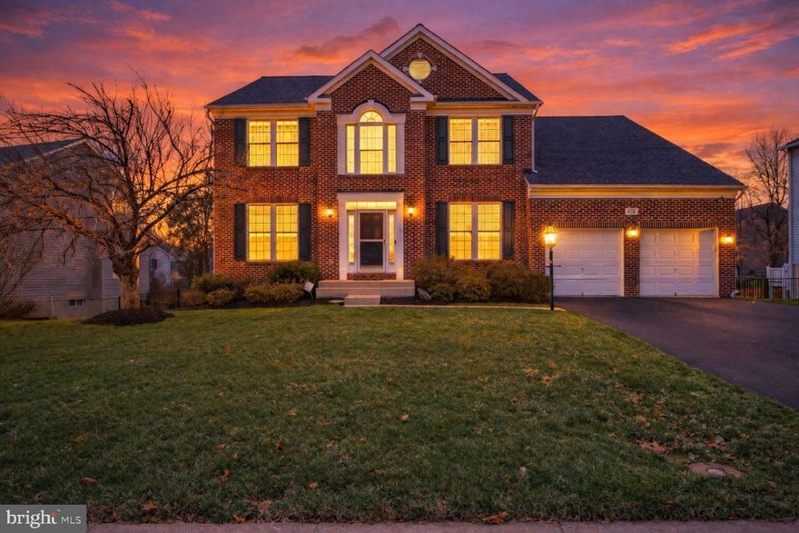 This impressive brick‑front colonial, in Bristow’s desirable Victory Lakes community offers 5 bedrooms, 3.5 baths, and over 4,900 finished square feet. The heart of the home is the gourmet kitchen with upgraded counters and cabinets with under and over lighting, seamlessly connected to dining and an extended family room pre‑wired for a home theater. Gorgeous hardwood floors grace the main level and primary suite. Enjoy privacy in the walk‑out basement backing to woods, and boasting a living area, bedroom and full bath, enjoy outdoor living on the maintenance free deck and screened in porch that spans the width of the home, with a lush yard serviced by a full sprinkler system and maintenance free fence. Located in the sought-after Victory Lakes community, residents enjoy an incredible array of amenities including: Three community pools, tennis, pickleball, and volleyball courts, basketball and street hockey courts, dog park, playground, clubhouse and fitness center.  Scenic walking trails throughout the neighborhood .  This home provides exceptional curb appeal, and is ready for your personal touch. Ideally located near commuter routes and shopping, this is suburban living at its finest.” Roof - 2018, HVAC - 2020, Water Heater - 2021
