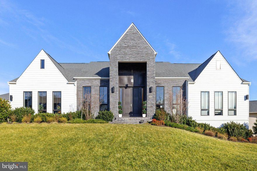 Stunning Noorderwind Model in the Sought after Grant at Willowsford. Breathtaking Piet Boon design details at every turn, gourmet kitchen island with custom Quartz bookends and table , custom Quartz shower accent shelves in baths, Quartz backsplash in glorious Master Bath, covered porch with fireplace, 3 car garage and fully finished lower level featuring a Mother-in-law suite. 4 glass sliding doors for indoor/outdoor living.  4 beds and 4 full baths on main level and 5th suite in lower level. Lush landscaping with whole house irrigation system. This home has it all! Located in Willowsford, the nation's community of the year, set in the rolling landscape of Loudoun County, inspired by Virginia's farming heritage! This resort style community offers numerous amenities including Community Pools, Clubhouse, Fitness Center, Community Events, zip line, tree houses, lakes, fishing ponds, water splash park, Willowsford Farm, and more! Easy access to Dulles Airport, Shopping, Restaurants, Vineyards, Commuter Routes and  Metro Rail Extension only 10 min out.