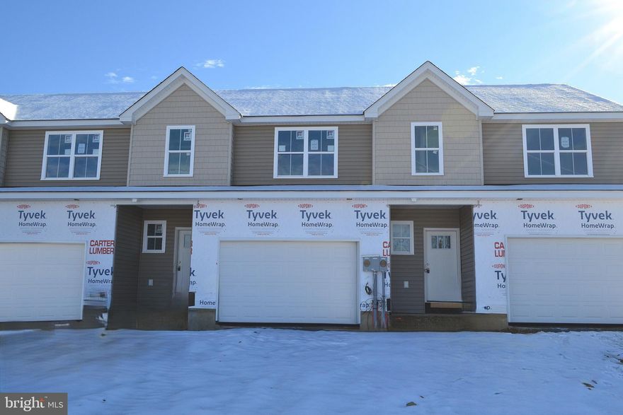 QUICK MOVE IN!  This gorgeous, modern craftsman-style home turns heads with its eye-catching stone facade, shake accents, and charming front door.  The heart of the home features a stunning, upgraded kitchen with a center island — perfectly connected to the dining and living spaces for easy entertaining or cozy nights in.  The open living spaces is a wide open, soaring great room with vaulted ceilings that instantly feels bright, airy, and welcoming.  Rear sliders lead to composite decks or concrete patios, depending on grade.  Upstairs, the spacious primary suite is your private retreat, complete with a primary bath with double bowl vanity and a walk-in closet big enough to impress. Two additional bedrooms, a full bath, and an oversized linen closet offer space for everyone.  These townhomes are designed with three professionally designed color palettes — so whether your style is bold, warm, or cool and modern, there’s an Addison that fits your vibe. Plus, this is truly low-maintenance living — the HOA takes care of lawn care and snow removal. Pair that with an oversized one-car garage and a location in charming Fleetwood, and you’ve got the ultimate in carefree, luxury townhome living.  One more thing...backed by the one-year Builder Warranty, we've got you covered!