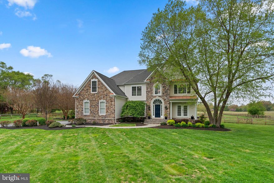 Come see the picture perfect retreat you have been waiting for.  A stunning stone front colonial situated on 2.5 acres, overlooking of fields and farmland, this custom 2005 built home has every luxury you can imagine, no detail overlooked. Over 5,500 square feet of finished living space offering 5 Bedrooms, 5 full Bathrooms, a gourmet kitchen,  fabulous great room, theater room,  home gym, spacious primary suite with sitting area, dual laundry rooms and so much more.  Entertain inside an out with a large chef inspired kitchen opening to the great room and the rear deck. Once outside, enjoy warm spring nights on the screened in porch overlooking the stunning salt water pool and manicured lawns.  Or relax and unwind after a long day in the hot tub while taking in the sunset. Easy commute- convenient to Annapolis, Washington & Baltimore. Close to shopping, dining, parks & entertainment- schedule your private tour today!