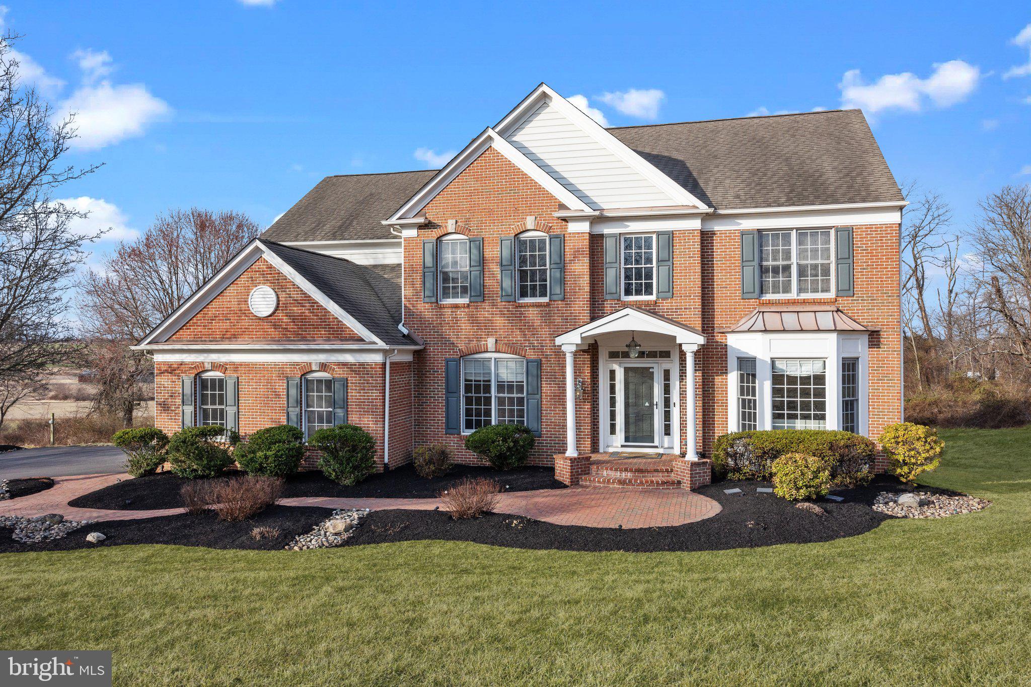 Welcome home to the one you've been waiting for! 106 Clover Rd is a beautifully updated 5-bedroom, 4.5-bath Center Hall Colonial located in the desirable Northampton Township within the Council Rock School District. Situated on one of the largest lots in the neighborhood, this property offers over 5,000 total square feet of living space across three stunning levels, providing ample room for your family’s needs. Nestled on a quiet 1.51-acre lot, the home offers privacy and breathtaking views and vistas of rolling hills and Bucks County farmland. As you arrive, you'll be greeted by an inviting brick front facade, mature landscaping, long driveway, and a brick walkway leading to the front door. Inside, the two-story foyer features hand-scraped wide-plank hardwood flooring, crown molding, and custom millwork. The impressive two-story family room boasts floor-to-ceiling windows framing a cozy gas fireplace and opens to the stunning kitchen. The gourmet kitchen is a chef's dream, featuring center island, walk-in pantry, stainless steel appliances, tiled backsplash and recessed lighting. Hickory 42” cabinets provide ample storage, while gorgeous granite countertops extend to a built-in desk area and breakfast bar. Adjacent to the kitchen, the sun-filled morning room with two walls of windows offers the perfect spot for your morning coffee and provides access to the expansive custom-built deck with panoramic views — ideal for hosting gatherings. The main floor also includes a private office with farmland views, an updated powder room with a smart toilet, copper sink, and wood floors, and a spacious laundry room with a modern washer and dryer. Upstairs, the luxurious owner’s suite features a coffered ceiling, a large walk-in closet, and an updated en-suite bath with a frameless glass shower, soaking tub, and newer faucets. The Jack-and-Jill bath, also updated with new Moen fixtures, connects two additional bedrooms. A fourth bedroom, a princess suite with a private bath, completes the upper level. The fully finished lower level offers even more flexible living space. This impressive area includes a propane cast-iron stove, a fifth bedroom, a fourth full bath, a built-in bar with a full sink and dishwasher, and multiple adaptable spaces for your needs. With ample windows and French doors, this space is bathed in natural light and provides access to the fenced backyard. Outdoors, you'll find a charming stone fire pit area, a patio under the deck, and a shed — both equipped with electricity. Countless updates enhance this home, including wood flooring, carpet, bathroom fixtures, light fixtures, and Lutron outlets/switches. SMART features include smart devices, switches, locks, and lighting. Plus, there are dedicated EV charging lines in the garage and at the end of the driveway. This exceptional property is nestled in a peaceful setting yet conveniently located near shopping and dining, with easy access to Newtown, Doylestown and Philadelphia. The owners have cherished their time in this warm and gracious brick-front colonial and are excited to pass it on to your family. With spectacular sunsets and protected rolling hill views, this home offers a perfect blend of classic charm and modern amenities.