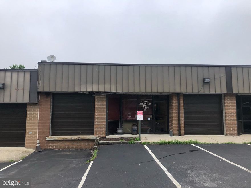 Rare primarily warehouse condo unit offered within this building/complex. Approximate unit dimensions are 25' wide by 60' deep. The front and back facades have nice window lines, along with an overhead door and loading dock. The unit comes with some outside shared fenced storage. There is also a small office within the unit. The current use/vacating is an upholstery business.