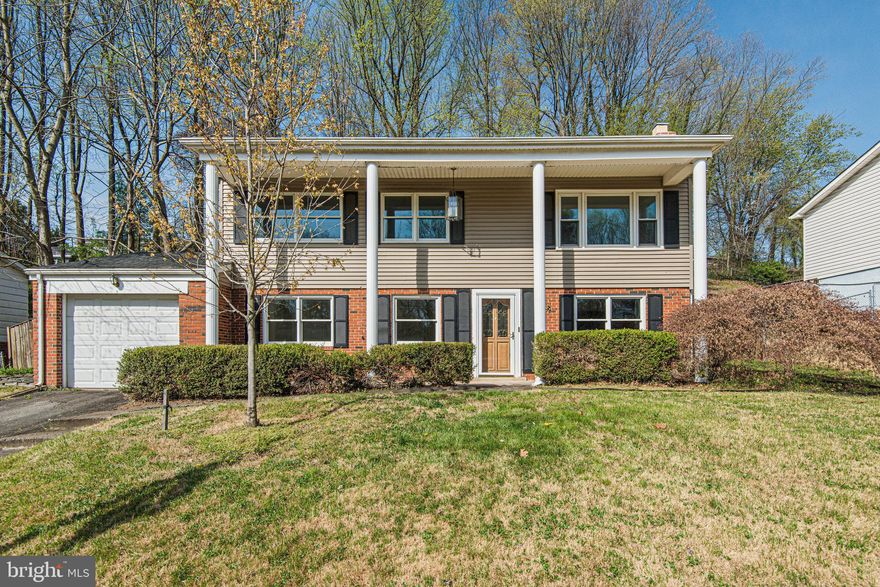 A great home with many updates and move in ready condition. Freshly painted throughout and in 2018 the home got three brand new bathrooms, new kitchen, roof, HVAC, windows  and ceramic tiled lower level flooring. The upper level has real hardwood floors throughout.  Natural sunlight fills the home. A front porch spans the front of the home with columns and there is a one car garage. The entry level is where you'll find a spacious family room with ceramic tiled flooring and a brick wall wood burning fireplace. This level also has two bedrooms and a full bathroom. Upstairs the kitchen features granite counter-tops, stainless steel appliances and plenty of cabinets. Two more bedrooms and 2 full bathrooms up here. The primary bedroom also has a walk in closet! The deck was re-built to code and has plenty of room for guests and a BBQ.