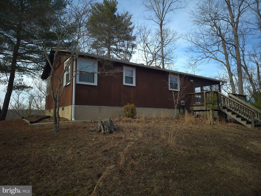 Own a piece of the beautiful Back Creek Heights community in Cross Junction. Located just minutes north of Winchester in the Dehaven part of the county. Access is secured via road frontage on Hodges Lane. Features a fully functional cabin with electric, well, and septic installed. The cabin features 2 bedrooms, 1 bathroom, and over 600 square feet of living space. Experience exciting hunting as many types of wildlife call this property home including deer, turkey, and many small game species. This tract is currently being used for recreational purposes. Stellar views of the surrounding countryside can be enjoyed year round. This property features mildly sloping topography, a pond, and a seasonal steam. Remote, fully wooded, and zoned Rural Areas (RA). Enjoy hiking, camping, and recreation of all types on this land. A short drive from all the amenities and attractions Winchester has to offer. 

***Additional adjoining acreage available for purchase. See aerials for details.***
***The land and cabin are being sold in AS-IS condition.***