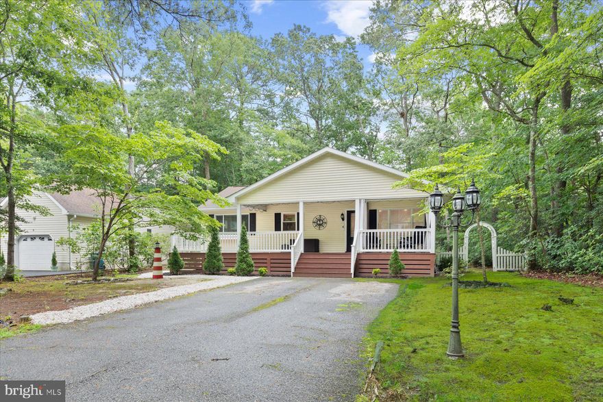 Welcome to your perfect coastal retreat in the sought-after South Gate of Ocean Pines! This beautifully maintained 4-bedroom, 2-bath home offers the ideal blend of style, comfort, and functionality, all nestled in a vibrant, amenity-rich community.  Step onto the expansive 10'x40' covered front porch with Trex decking—perfect for enjoying your morning coffee or evening drink while taking in the peaceful wooded surroundings. Inside, you'll be greeted by a bright, open-concept layout featuring luxury vinyl plank flooring throughout, creating a modern and seamless flow from room to room.  The gourmet kitchen is a chef’s dream with granite countertops, stainless steel appliances,  luxury vinyl flooring, ample cabinetry, a large breakfast bar, pantry, and updated lighting. A versatile flex space—currently used as a gym and laundry area—offers the flexibility to serve as a home office, playroom, or family room. French doors provide the option to section off part of the living space for privacy or additional living areas.  Both bathrooms include updates, and the spacious primary suite includes an updated en-suite bath and custom closet shelving. Nearly every detail has been thoughtfully updated—from matching cabinet hardware and door knobs to recessed lighting, smart thermostat, and a keyless front door entry.
Enjoy peace of mind and low-maintenance living in a home that is as move-in ready as it is charming.  The backyard is ideal for entertaining or quiet enjoyment and includes a storage shed for your tools and toys.  Don’t miss your chance to own a piece of Ocean Pines paradise.  With its unbeatable location, thoughtful upgrades, and inviting layout, this home is the perfect haven for coastal living.