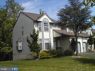 Awesome end unit Townhouse with almost 3,000 square feet of living space situated in Newtown Grant featuring finished walk-out basement, family room w/fireplace, master bedroom suite, master bath w/garden tub, remodeled powder room with ceramic tile floor, walk out patio and second level deck, garage and professionally landscaped. Second level deck! Backs to woods One of a kind Newtown Grant townhome with a basement Also 4 Beedrooms if you need that home office ! Needs some updating but backing to woods its worth it!