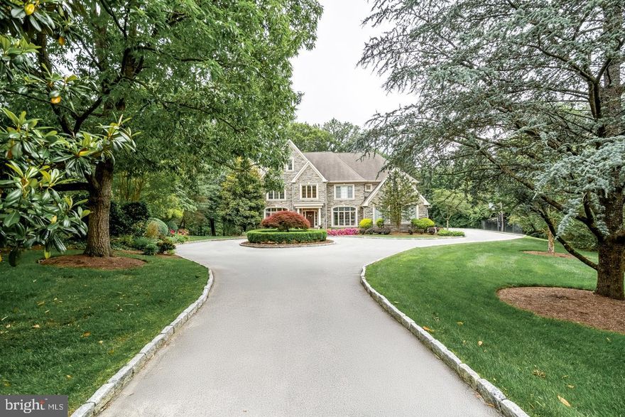 Discreetly tucked away, at the end of a private lane in Bryn Mawr's most prestigious estate section, is 
841 Colony Court. This custom-built home showcases the finest in luxury living, prime location, and sophisticated lifestyle. This residence is set on 1.5 of lush, manicured acres, showcasing mature landscaping and rare perennial plantings. You will be overwhelmed when you approach the home from the impressive circular driveway and see the impressive stone facade. No detail has been overlooked in this residence that has been impeccably upgraded both inside and out. The gracious foyer makes an elegant impression with a stately staircase rising to an open landing. Soaring ceilings, extensive custom millwork, designer finishes and finished on site hardwoods are throughout the main level. True to the classic center hall floor plan, the spacious dining room with a picture window is on the right of the foyer and the formal living room with fireplace is located to the left and a powder bath is located discreetly tucked away here as well. Glass-paneled wood doors in the living room open to an impressive, wainscoted office complete with custom bookcases. A wet bar/butler's pantry connects the dining room & chef's quarters for easy serving when hosting guests. The ultimate gathering spot is the stunningly renovated kitchen, centered by a huge island with generous seating. Custom cabinetry, a La Cornue range/oven, Wolf wall and steam ovens, 48" Sub-Zero refrigerator & custom walk-in butler's pantry enhance the heart of the home. Enjoy casual meals in the open breakfast room, step out sliding glass doors to the large deck for outdoor dining and entertaining, or relax in the family room with a fireplace flanked by built-ins to watch TV or movies. Rear stairs, a mudroom, garage access and a second powder room sit conveniently by the kitchen. The 2nd story covered in plush, high-quality carpeting presents a magnificent primary suite with a vaulted ceiling in the bedroom, spacious sitting room and 2 custom-fitted walk-in closets. Your new luxurious spa bath is styled with custom cabinetry, dual sinks, freestanding tub and oversized shower. Three more-bedroom suites offer generous closets with custom built-ins and en-suite baths. Additionally, there is a 2nd office and laundry room, both with built-ins as well. The finished basement is perfect for recreation with a family/media room, open billiards/game area, gym and another full bath. DO NOT miss this stunning home.