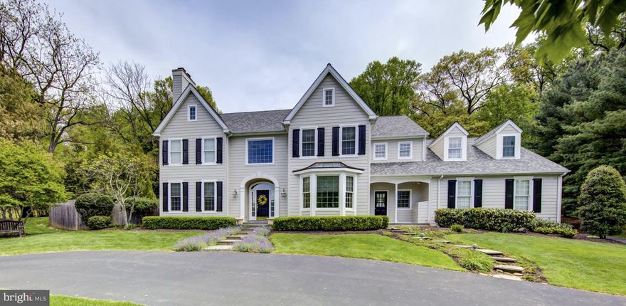 Impressive Colonial Manor  custom built by Nemeth Construction sits prominently on beautiful acre lot with circular drive on private cul-de- sac in Wayne. All New Hardie Board Siding installed in March of 2022. Lovely flagstone patio overlooks elegant gardens and landscape. Wonderful architectural details  and only the finest quality materials. 5 Bedrooms 4 full baths , 3 Powder rooms , 3 fireplaces ,finished  daylight lower level  with wine cellar and lots of family space.   
The roof was replaced in 2020, two zone HVAC was replaced in 2018 and 2020 and many of windows have been replaced thruout the house. Elegant Two Story Center Hall with turned staircase, hardwood floors and two beautiful Cased openings to Living Room and Formal Dining Room. Living Room features hardwood floors, crown moulding, lovely gas fireplace with traditional wood mantel with marble surround and hearth and double doors to private study.  Study boasts beautiful built in bookcases, hardwood floors, crown moulding and recessed lighting.. Formal Dining Room offers hardwood floors, crown moulding , chair rail and triple bay window and adjoins lovely Butlers pantry with cherry display cabinetry, stainless steel wet bar, granite countertops and wine cooler. Cheery White Wood mode Kitchen with cherry island  and granite countertops  with top of the line stainless steel appliances with large breakfast area with sliders to patio and stunning rear grounds. Kitchen adjoins large Family Room with vaulted ceiling, large feature window, built in entertainment unit, gas fireplace and hardwood floors. Family room also adjoins the study. A powder room off center hall, large mud room with access to three car garage and door to the front side of the house and a separate laundry room, backstairs and a second powder room complete this level.  The second floor hallway to master suite features hardwood floors and a large feature window overlooking front grounds.  Fabulous Master suite features lovely sitting room with gas fireplace  with traditional wood mantel with marble hearth and surround and opens to spacious master bedroom with abundance of windows, recessed lightning, his and her customized closets and a large redone master bath with oversized tile floor with accent tile, cherry vanities, and make up area, an oversized  soaking tub, large stall shower and separate commode room. Second bedroom feature wall to wall carpeting and private bath with tub with shower. Bedroom 3 and 4 share a large hall bath with double vanities. Stairs to third floor suite which feature bedroom and large sitting room with access to attic storage and full bath with tub/ shower. Finished Daylight lower level features large custom wine cellar with room for tasting and dining The lower level carpeting we just replaced. Large  Family room entertainment area, exercise area and a third powder room complete this level. This location is minutes from downtown Wayne for shopping, restaurants and train, minutes to  Wegmans, and all the shopping at  the Mall, , restaurants and movies in King of Prussia.  Convenient to All local highways for commuting to Center City, the Airport and the Route  202 and 422 corridor. Great value!!