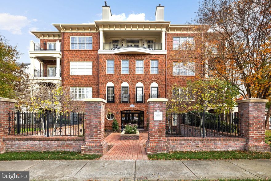 Presenting an elegant Penthouse residence situated in esteemed Monument Square, w/ a secure entrance & a convenient elevator that opens into a welcoming foyer. The formal rooms exude sophistication, featuring tasteful crown molding & classic columns. Experience culinary finesse in the well-appointed designer kitchen, complete with stainless steel Wolf appliances, granite counters, a granite island, & double ovens. The adjacent breakfast room transitions to an outdoor balcony, offering a refreshing retreat. The living room, adorned with French doors & a gas fireplace, extends to yet another balcony, providing a relaxed ambiance. Entertain in style w/ a spacious dining room, accompanied by a convenient butler’s pantry featuring a wine refrigerator & copper sink. The generously sized primary suite includes a comfortable sitting room that opens to the balcony. The residence is equipped with SONOS surround sound, recessed lighting, plantation shutters, & 5' plank red oak cherry flooring. For everyday convenience, a large laundry room features cabinets & a laundry sink. The large, two-car garage is designed for practicality, with ample space & a remote entrance for ease of use.