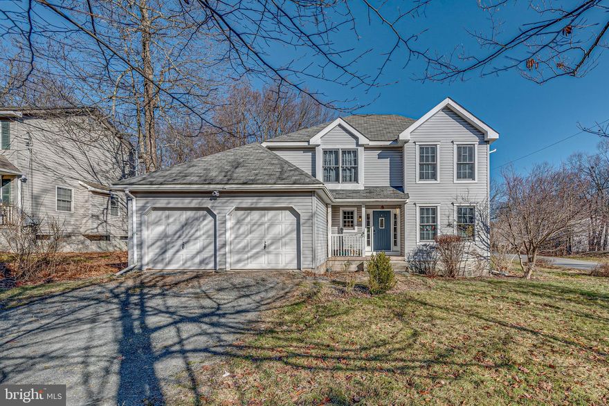 Turnkey, beautifully renovated, and featuring a layout buyers are actively searching for—this 4-bedroom, 2.5-bath Pocono home stands out from the rest. The highlight? A true first-floor primary suite with private bath and walk-in closet—offering the kind of convenience and flexibility that’s hard to find. The main level is built for easy living and entertaining, with a seamless flow between the living room, dining area, and kitchen, plus a spacious family room with vaulted ceilings, a stone gas fireplace, and oversized arched windows that fill the space with natural light. A first-floor laundry room and half bath add everyday practicality. Upstairs, an open overlook enhances the home’s airy feel and leads to three generously sized bedrooms and a full bath—perfect for guests, family, or work-from-home space. Step outside to enjoy a covered front porch and a large back deck, all set on a desirable corner lot with room to relax or entertain. Located in a low-fee HOA community ($155/year) with clubhouse access, and just minutes to major highways and the best of the Pocono Mountains, this home offers the ideal mix of comfort, style, and location. Move right in and start enjoying it from day one or