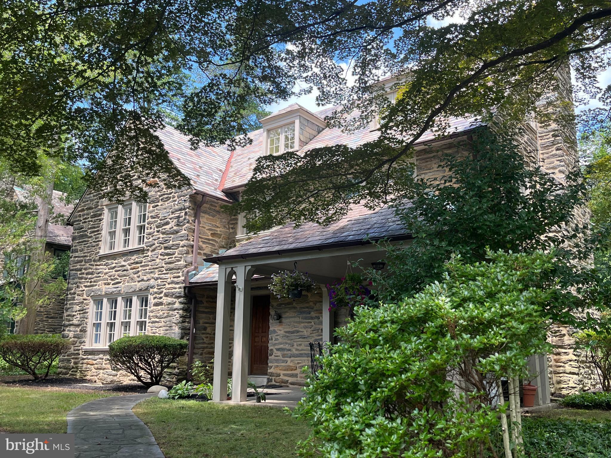 A classic Stone Mt Airy 2.5 story home on a beautiful corner lot. All the charm of a vintage home remains, including beautiful original woodwork. Enter into a generously sized foyer which splits an elegant large living room on one side and large dining room on the other. Both rooms have abundent natural light. The entire home, including woodwork, is freshly and professionally painted and all the floors throughout this elegant home have hardwood. The woodwork is original to this classic home.
The kitchen has been replaced including the addition of Granite countertops. Behind the kitchen is the first floor laundry room which has an entrance from the outside.
All 7 bedrooms (including maids room), are generous in size. 4 are on the second floor and 2 are on the third. The second floor has the master bedroom and private master bath, plus 3 other bedrooms and 2 additional baths . The 3rd floor has a bath between the two bedrooms. Full Maids Quarters with living room bedroom and bathroom are on the second floor. Maids Quarters is totally private and has a separate flight of steps to the kitchen . Gas hot water heat is supplemented by a heat pump. There is walking distance to 3 train stations and a Weavers Way coop neighborhood grocery store.