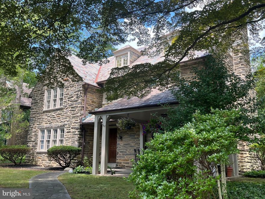 A classic  Stone Mt Airy 2.5 story home on a beautiful corner lot. All the charm of a vintage home remains, including beautiful original woodwork.   Enter into a generously sized foyer which splits an elegant large living room on one side and large dining room on the other. Both rooms have abundent natural light.   The entire home, including  woodwork, is freshly and professionally  painted and all the  floors throughout this elegant home have hardwood.  The woodwork is original to this classic home. 

The kitchen has been replaced  including the addition of Granite countertops.  Behind the kitchen is the first floor laundry room which has an entrance from the outside. 
All 7 bedrooms (including maids room), are generous in size.  4 are on the second floor and 2 are on the third. The second floor has the master bedroom and private master bath, plus 3 other bedrooms and 2 additional baths . The 3rd floor has a bath between the two bedrooms.  Full Maids Quarters with living room bedroom and bathroom are on the second floor. Maids Quarters is totally private and has a separate flight of steps to the kitchen . Gas hot water heat is supplemented by a heat pump. There is walking distance to 3 train stations and a Weavers Way coop neighborhood grocery store.