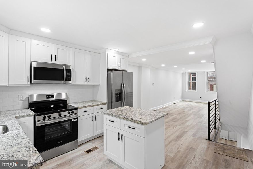 Welcome to this fully renovated 2-bedroom, 2-bathroom home in the Point Breeze neighborhood of Philadelphia—perfect for buyers searching for modern city living with convenience and charm. Nestled on a tree lined street, this move-in-ready home offers the ideal blend of comfort, style, and location. Walk into an open-concept floor plan featuring natural light, brand-new flooring, and modern finishes throughout. A kitchen is designed to impress with granite countertops, a spacious island with storage, and stainless steel appliances, including a refrigerator with ice maker and water dispenser. As you walk upstairs, you’ll find two generously sized bedrooms, including a primary suite with a private ensuite bathroom. Both bathrooms are thoughtfully updated with sleek, modern finishes. The fully finished basement adds valuable living space—ideal for a home office, gym, media room, or guest area—along with ample storage. BONUS: A BRAND NEW SEWER LINE PROVIDES ADDED PEACE OF MIND FOR FUTURE HOMEOWNERS. Enjoy outdoor living in your private backyard patio—perfect for relaxing, grilling, or hosting guests. Located in one of Philadelphia’s fastest-growing neighborhoods, this home is within walking distance to Washington Avenue and surrounded by local favorites including restaurants, coffee shops, gyms, yoga studios, and farmers markets. Easy access to SEPTA public transportation, including the Broad Street Line and major bus routes, makes commuting to Center City, University City, and the South Philadelphia Sports Complex effortless. This is your opportunity to own a turnkey home in Point Breeze—ideal for first-time homebuyers, investors, or anyone looking for a modern Philadelphia rowhome in a prime location.