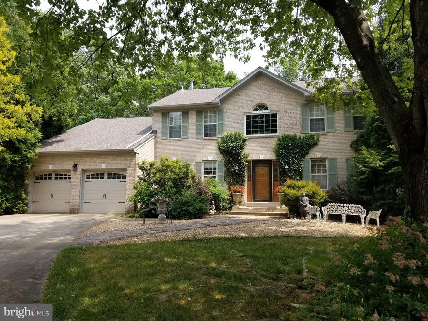 Welcome to this stunning 4-bedroom, 3 and 1/2-bath colonial home nestled in a peaceful cul de sac. As you enter, you'll be greeted by a grand 2-story foyer, setting the tone for the elegance that awaits. The main level features a formal dining room, perfect for hosting memorable gatherings. The updated kitchen boasts stainless steel appliances and rich dark cherry cabinets, complemented by warm cherry floors, creating a contemporary and inviting atmosphere.

The family room is the heart of the home, complete with a cozy wood-burning fireplace, ideal for relaxing evenings with loved ones. Open the sliding doors to the large deck to grill out or enjoy the outdoors. Upstairs, you'll find spacious bedrooms, providing ample space for rest and relaxation. The convenience of an upper-level laundry makes everyday chores a breeze.

The basement offers even more entertainment options, with a separate bedroom, a full bath, a fireplace, and a bar. It's the perfect space for hosting guests and creating unforgettable memories. Step outside onto the patio and enjoy the peaceful view of the private fenced yard, which backs to beautiful trees. This tranquil setting provides a serene escape from the hustle and bustle of daily life.

Don't miss the opportunity to make this incredible home yours. With its desirable features, including the formal dining room, updated kitchen, wood-burning fireplace, and fantastic basement entertainment area, this colonial gem is sure to exceed your expectations. Schedule a showing today and experience the charm and tranquility of this wonderful property.