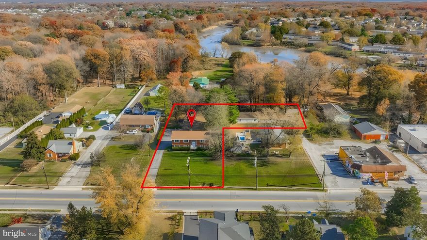 This expansive homesite, surrounded by open green space and mature trees, boasts a second separately deeded and buildable lot included in the sale, offering rare flexibility and long-term potential. Beautifully renovated in 2025, the Raised Ranch/Split-Foyer provides over 3,000 sq. ft. of bright above-ground living with recessed lighting and new flooring throughout, and a brand-new open-concept kitchen with stainless appliances, soft-close white shaker cabinetry, a large granite island with breakfast bar seating, and a sink overlooking the deep backyard. The home offers two master suites with en-suite bathrooms, walk-in or extra-deep closets, and space for king beds, along with four elegantly remodeled bathrooms featuring walk-in showers, marble tile work, pocket shelving, and refined designer finishes. The property includes five total large bedrooms, with even the two smallest measuring over 11' x 11' and offering 5-ft-wide closets, providing comfort, scale, and versatility for family living, guests, or multigenerational arrangements. The upper living level features a brick wood-burning fireplace and sliding doors leading to an expansive deck perfect for entertaining, while the lower level provides a spacious family/rec room with built-in shelving, a second brick fireplace, and walk-out access to the back patio. The wide and deep fully fenced yard is ideal for gatherings, gardening, pets, play areas, RV or boat parking, and evenings around the fire pit. The separately deeded lot includes a 40' x 30' (1,200 sq. ft.) oversized two-car garage with finished flexible rooms for office, storage, workshop, or hobby use, and even the potential to build upward for added value or income.  With parking for 10+ vehicles and no HOA, this property delivers space, privacy, usability, and future opportunity rarely found together.  The two properties included in the sale are Tax ID 04151506101001 and 04151600003411. Come see this property now—this one won’t last long!!