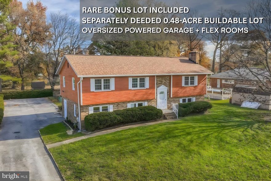 This expansive homesite, surrounded by open green space and mature trees, boasts a second separately deeded and buildable lot included in the sale, offering rare flexibility and long-term potential. Beautifully renovated in 2025, the Raised Ranch/Split-Foyer provides over 3,000 sq. ft. of bright above-ground living with recessed lighting and new flooring throughout, and a brand-new open-concept kitchen with stainless appliances, soft-close white shaker cabinetry, a large granite island with breakfast bar seating, and a sink overlooking the deep backyard. The home offers two master suites with en-suite bathrooms, walk-in or extra-deep closets, and space for king beds, along with four elegantly remodeled bathrooms featuring walk-in showers, marble tile work, pocket shelving, and refined designer finishes. The property includes five total large bedrooms, with even the two smallest measuring over 11' x 11' and offering 5-ft-wide closets, providing comfort, scale, and versatility for family living, guests, or multigenerational arrangements. The upper living level features a brick wood-burning fireplace and sliding doors leading to an expansive deck perfect for entertaining, while the lower level provides a spacious family/rec room with built-in shelving, a second brick fireplace, and walk-out access to the back patio. The wide and deep fully fenced yard is ideal for gatherings, gardening, pets, play areas, RV or boat parking, and evenings around the fire pit. The separately deeded lot includes a 40' x 30' (1,200 sq. ft.) oversized two-car garage with finished flexible rooms for office, storage, workshop, or hobby use, and even the potential to build upward for added value or income.  With parking for 10+ vehicles and no HOA, this property delivers space, privacy, usability, and future opportunity rarely found together.  The two properties included in the sale are Tax ID 04151506101001 and 04151600003411. Come see this property now—this one won’t last long!!