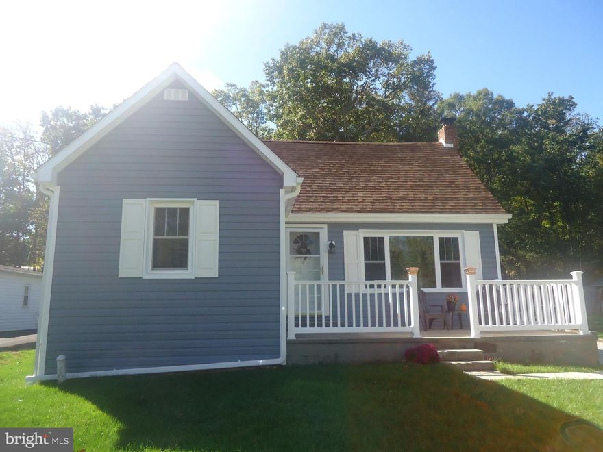 Well kept remodeled Cape Cod home with front porch and rear deck w/hot tub. Equipped kitchen with ceramic tile floor. Propane fireplace in living Room. Hardwood floors; main level washer/dryer. New replacement windows throughout. Main level master. 2-Car carport. Central Air. Large lot with unique landscaping & gazebo. Large shed with 2nd floor workshop 12 x 20. Beautiful mountain setting.