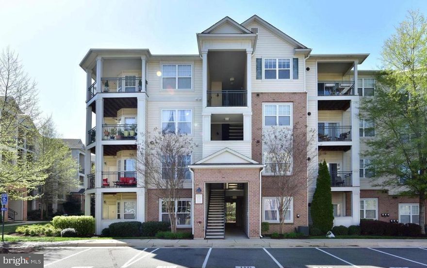 Beautiful, spacious, light filled unit w/high ceilings in fantastic gated community, close to shopping, dining, highways, and transportation! Recent updates include new water heater 2022, stainless steel appliances, updated floors, fresh paint! 

Community fitness center, pool, and party room! 2 Assigned parking spots and guest parking available. Ceramic Tile foyer. Updated Hardwoods in living areas. Granite Counters. Laundry in unit. Private patio with view to the woods, large walk in closets and Master bath, and so much more!