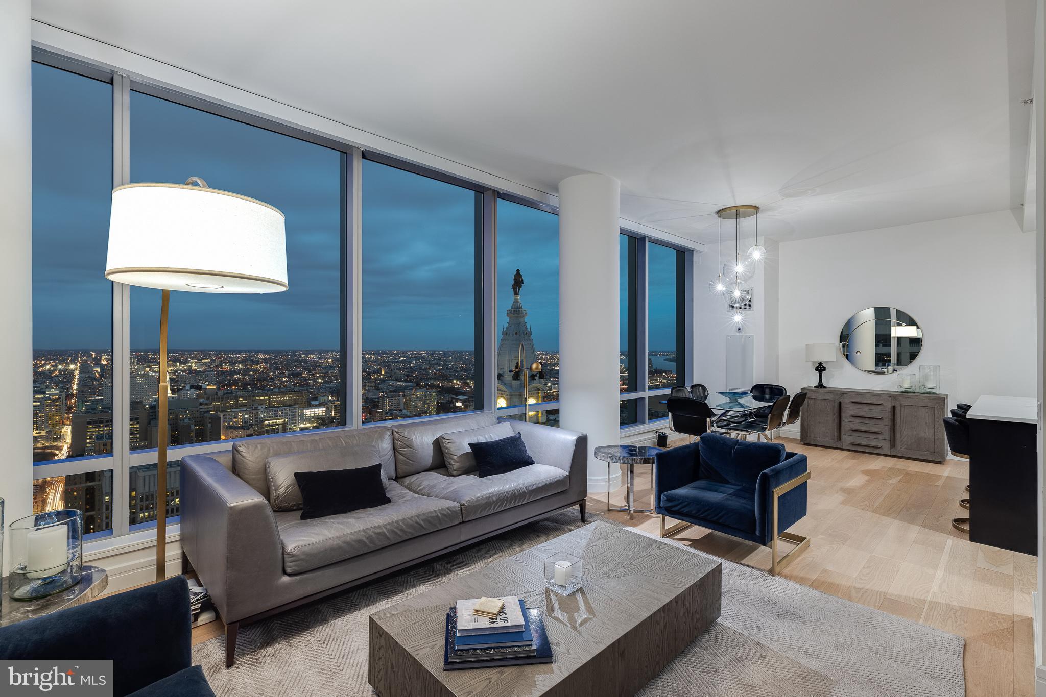 1 Car Parking Included, optional second space available. This 2 bed, 2.1 bath stunning UPDATED TURN KEY corner residence features 1645 square feet with some of the most incredible sunsets, skyline, and City Hall views you won't find anywhere else.
In this completely renovated spacious residence, you have unobstructed views of City Hall, 2 Liberty, the ever-evolving Philadelphia skyline, and gorgeous sunsets. This unit also includes floor to ceiling operable windows in every room (a unique feature in Center City), soaring ceilings, gorgeous new white oak wide width hardwood floors throughout, a designer kitchen featuring Sefina cabinetry, an oversized quartz island, Viking built-in gas cooking and microwave, Sub-Zero refrigerator, Miele dishwasher, Uline wine cooler, Dornbracht fixtures. The master suite features California Closets, incredible City Hall views, Calacatta marble floors and countertops, double vessel sinks, Bain ultra-soaking tub, Duravit commode, and a separate stall shower with a frameless glass enclosure.
The Ritz-Carlton Residences is genuinely the finest white-glove building Philadelphia offers in Center City living. You will have access to a resident-only Mercedes S560 as well as a Cadillac Escalade to make getting around town a delight. If you prefer walking, are mere steps to the best restaurants, shops, and parks.
World-class amenities found at the Ritz-Carlton Residences Philadelphia include a state-of-the-art fitness facility overlooking City Hall & Dilworth Plaza, an indoor pool, spa, locker rooms, sauna, private Yoga room, and brand new Resident Lounge with outdoor area and unbelievable theater room. This building is pet-friendly with an on-site dog run.