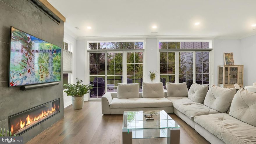 Set along one of the most coveted stretches of Main Street in New Hope, this exceptional Riverwalk residence represents a refined expression of luxury living, where sophisticated design, elevated finishes, and an extraordinary walkable setting converge seamlessly. Built just four years ago by Barley Custom Homes, the home showcases impeccable craftsmanship and thoughtfully curated interiors across nearly 3,600 square feet.
A welcoming front porch offers a graceful introduction before opening into a light-filled interior defined by soaring 10-foot ceilings and a dramatic foyer. Designed with both elegance and livability in mind, the main level unfolds effortlessly, anchored by a stunning great room with fireplace and walls of tall glass doors that flood the space with natural light while creating a seamless connection between indoors and out. The great room flows seamlessly into the chef’s kitchen, complete with Wolf  Sub-Zero appliances, a six burner range, a generous walk-in pantry, and spaces tailored for elevated entertaining and everyday ease. A private office, thoughtfully designed mudroom with abundant storage, and attached two-car garage further enhance the home’s functionality without compromising design.
Perfectly positioned along the towpath with the Delaware River just across the street, the setting offers a rare balance of privacy and connection. Enjoy effortless walkability to the acclaimed restaurants, boutiques, galleries, and vibrant cultural energy that define New Hope, while the charming river town of Lambertville is just moments away. Here, daily life is immersed in the beauty and rhythm of one of the region’s most sought-after destinations.
The second level features four beautifully appointed bedrooms, each complemented by their own ensuite bath, offering both comfort and privacy throughout. One bedroom opens directly to a private balcony, creating a quiet retreat overlooking the surrounding landscape. The primary suite is a sophisticated sanctuary, featuring a spa-inspired bath with an oversized glass shower, dual vanities, and a sleek, modern aesthetic designed with understated luxury in mind. A well-positioned second-floor laundry room and airy loft space further elevate the home’s thoughtful design and livability.
An elevator services all floors, leading to a third-floor loft and flex space complete with a full bath, ideal for a guest retreat, lounge, playroom, or additional living area, along with generous storage integrated throughout.
Outdoor living is equally compelling, with a private deck overlooking the towpath and a setting that effortlessly blends nature, luxury, and walkable Main Street living.
This is more than a home, it is a rare lifestyle offering in one of Bucks County’s most iconic river towns, where timeless architecture, effortless luxury, and an unparalleled location come together in a way that must be experienced to be fully appreciated.