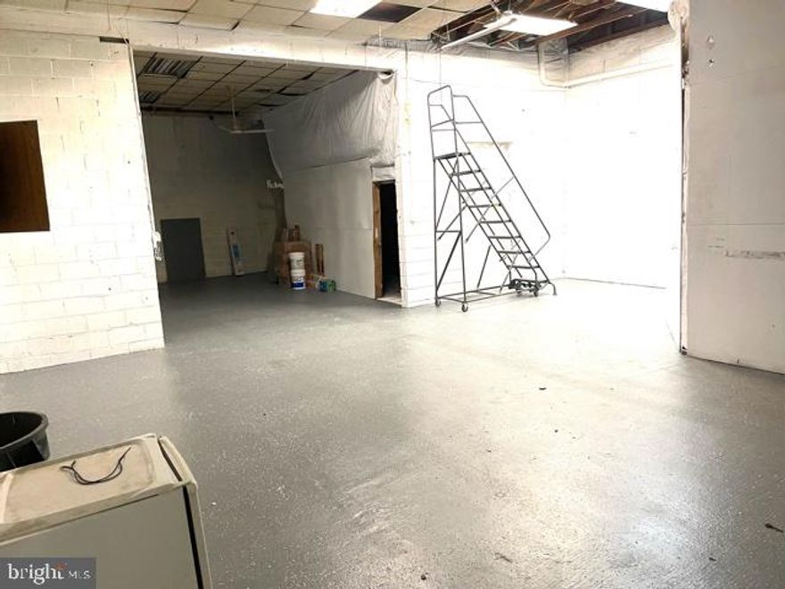1650 SQ. FT. GARAGE BAY AVAILABLE FOR RENT - PERFECT FOR A CAR REPAIR SHOP OR CAR DETAILING.  This bay is 55ft by 30ft and has 13 ft ceilings, an 11 ft. roll up door, and concrete flooring and parking available in the parking lot for multiple cars.  Tenant is responsible for BGE bill