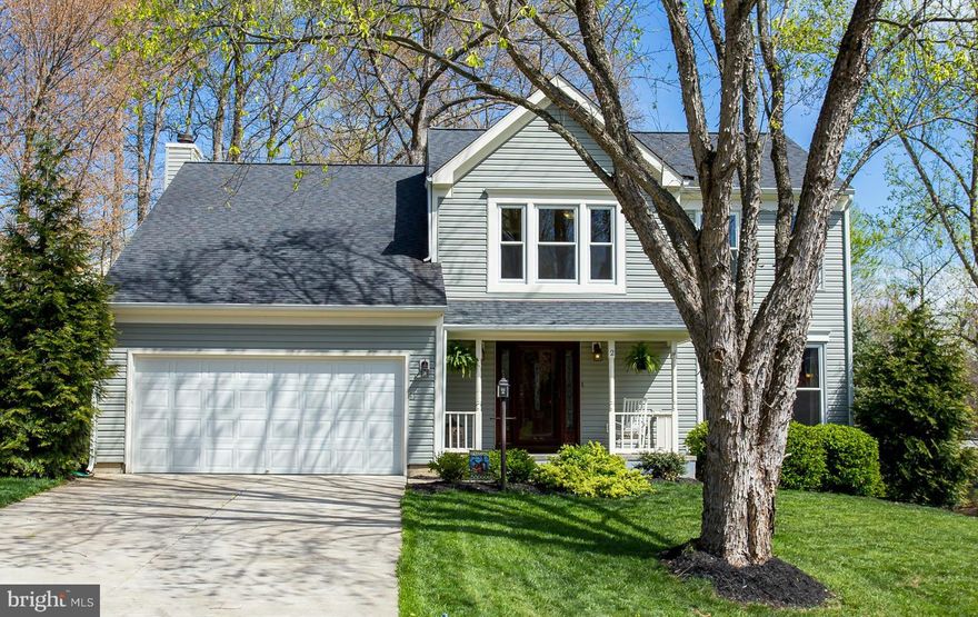 WOW- PRISTINE 3 LEVEL COLONIAL ON LARGE CORNER LOT!  UPGRADED KITCHEN WITH QUARTZ COUNTER TOPS, 42" CABINETS, PORCELAIN TILE, & GLASS TILE BACKSPLASH! WIDE PLANK WOOD FLOORS, ALL BATHS REMODELED WITH CUSTOM TILE WORK AND VANITIES, NEW PERGO FLOORING, NEW SIDING, NEW WINDOWS, NEW CONCRETE DRIVE, NEW CARPET, CUSTOM MOLDINGS, CATHEDRAL CEILINGS, 2 MASTER BEDROOMS, WALKOUT BASEMENT WITH BAR, AND MORE!