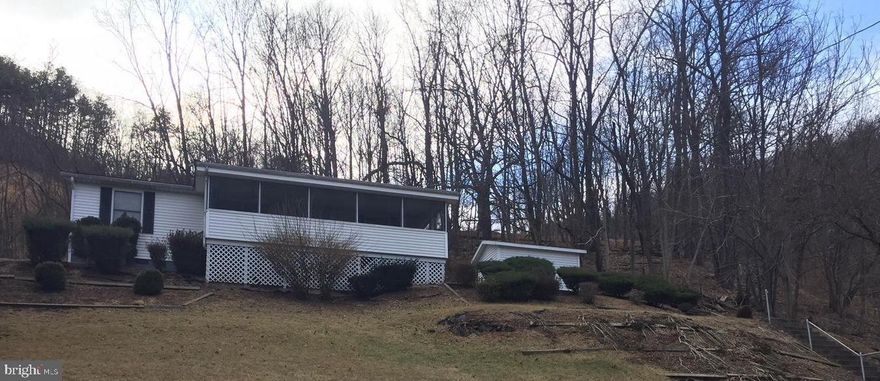 Cute little rancher on just over a half acre featuring 2 bedrooms, 2 baths,  Large living room, dining area and a nice size screened in front porch with beautiful mountain views.  Carport and small storage shed.   Ready to move right into and make it your own..... Call today for a showing