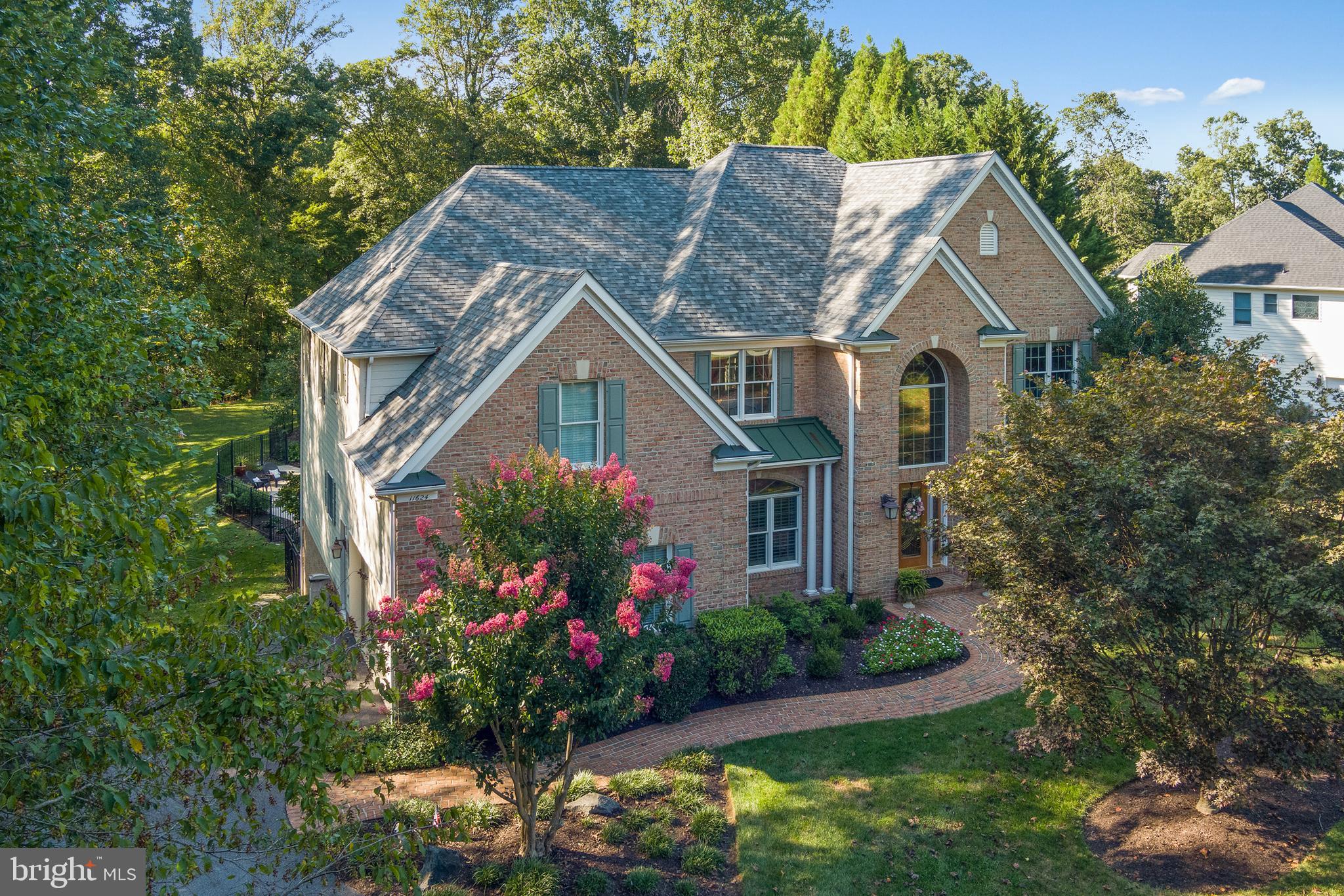 Stunning brick front colonial nestled on a picturesque 1.14 acre manicured homesite in coveted Quarterfield on a quiet cul-de-sac street. Custom built Greenfield home has over a total finished square footage of 6100 square feet, designed and built with both luxury living and casual fun in mind. An impressive 2-story foyer provides a view of the elegant interiors enhanced with beautiful hardwoods, Palladian windows, crown moldings, radiant natural light leads you to a two story family room. The rooms' tour begins in a formal living room with wood louvre shutters and a formal dining room adorned with a tray ceiling and ceiling medallion, the perfect setting to host intimate holiday events. Levels of windows frame the gorgeous backyard and draws you into the 2-story great room featuring a stunning floor to ceiling stone fireplace, built in's and 2 ceiling fans. The adjacent kitchen features white cabinetry, stainless steel appliances, quartz counters, a center island complete with 5-burner Jenn-Air gas cooktop, double wall oven, pantry and a breakfast bar. Adjacent breakfast room with full windows to enjoy your morning coffee overlooks the outdoor oasis and wooded views. Upstairs the primary suite presents a tray ceiling with elegant dentil molding, a sitting room with a splendid view, an expansive walk in closet, recently renovated bath complete with soaking tub, dual vanities with quartz counters, and glass enclosed shower with granite. The expansive lower level offers endless opportunities for fun and socializing. The rec room is a perfect place to watch movies, enjoy the gas fireplace and play a game of pool and games. A bonus room completes the space, ideal for weight training and second office. Step outside to an oasis off the kitchen or basement level. Outdoor Fiberon composite deck is party-sized and has dual staircases leading down to the pool area. Extensive patio surrounds a resort style saltwater pool complete with spa and cascading waterfalls. A backyard like no other, it was created with entertaining in mind, perfect backdrop for hosting prom pictures, graduation parties, the pool area features lush landscaping and ultimate privacy in the backyard. Additional flat yard space behind the fence as well. Roof was recently replaced in December of 2021. HVAC upper zone replaced 2017, lower zone replaced 2020, well pump replaced 2019. Upstairs carpet replaced 2022. Hot Water heater replaced 2022. Basement doors replaced 2022. Pool tiles and coping replaced 2019. Generator conveys. Neighborhood feels like you are remote, yet it is so close to shopping, and commuter routes, including I-70, Route 32, and Route 29. This one won't last long. Seller reserves the right to choose a contract at any time.