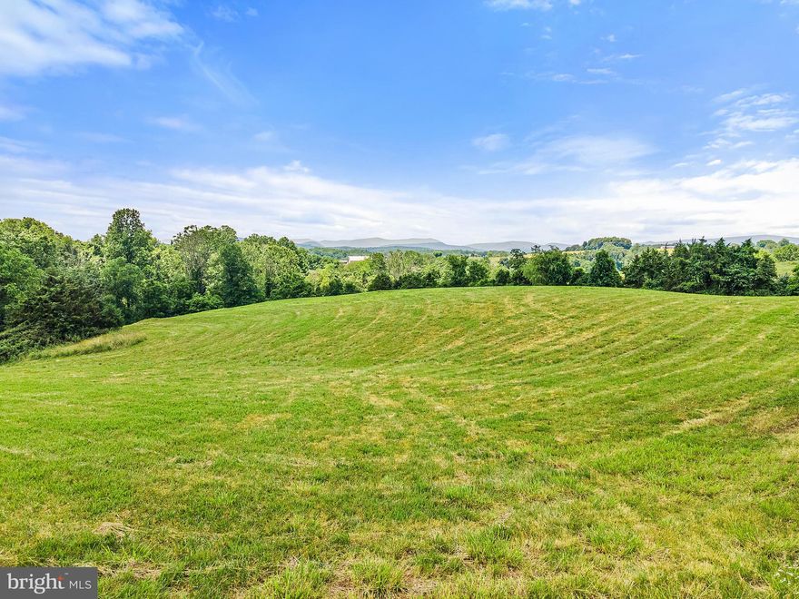 Beautiful, gently rolling 5 acre lot.  Lovely views and a perfect place to build your home.  This property has recently been surveyed and approved for a 4 bedroom conventional septic system.  DO NOT DRIVE IN NEIGHBOR'S DRIVEWAY.  GO THROUGH THE GATE TO VIEW LOT, WELL MARKED WITH CENTURY 21 SIGNS. USE NEIGHBOR'S ADDRESS of 6188 DOCS RD FOR DIRECTIONS.